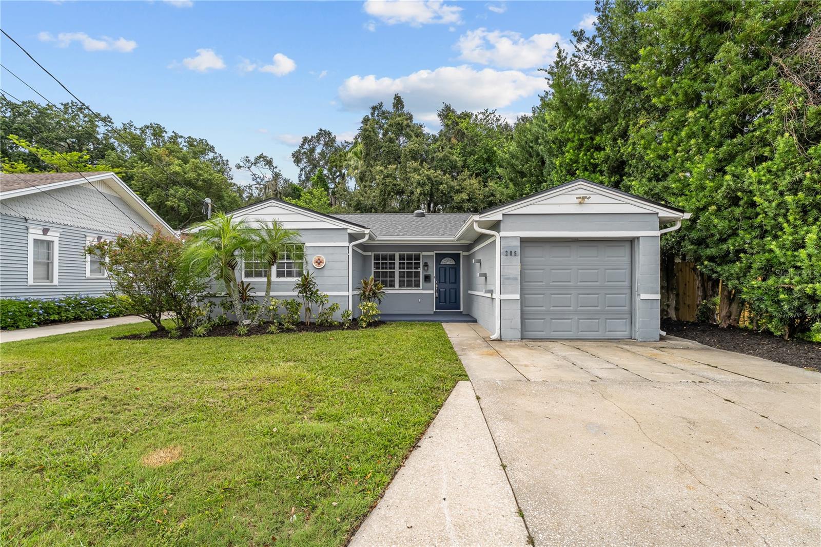 One or more photo(s) has been virtually staged. Beautifully Updated 3-Bedroom BLOCK HOME in the Heart of College Park – Just Minutes from Downtown Orlando! NO HOA! With charming curb appeal, a BRAND-NEW ROOF, and a prime location, this home offers the perfect blend of style, comfort, and convenience. Step inside to discover a bright and spacious main living area featuring elegant wood-look tile flooring and abundant natural light. The remodeled kitchen is a true showstopper, boasting stainless steel appliances, high-quality cabinetry, stone countertops, and a cozy dining nook that’s perfect for casual meals or morning coffee. The oversized primary suite is a private retreat, complete with ample space for a reading area, direct access to the screened lanai, and a luxuriously upgraded ensuite bath featuring a glass-enclosed shower. Two additional guest bedrooms are located toward the front of the home, each with easy access to a full guest bath and an additional half bath—perfect for visitors or a growing family. Step outside to your expansive screened-in lanai—ideal for entertaining or relaxing year-round—overlooking a fully fenced backyard that’s perfect for pets, play, or future garden projects. Situated just moments from the popular restaurants, coffee shops, and boutique shopping along Edgewater Drive, and only a short drive to Winter Park’s acclaimed Park Avenue, this location can’t be beat. Quick access to I-4 puts you just 15–20 minutes from the theme parks, 30 minutes to Orlando International Airport, and under an hour from the beautiful East Coast beaches. Don’t miss this opportunity to own a gorgeous, move-in-ready home in one of Central Florida’s most vibrant communities. Schedule your showing today—you’ll be glad you did!