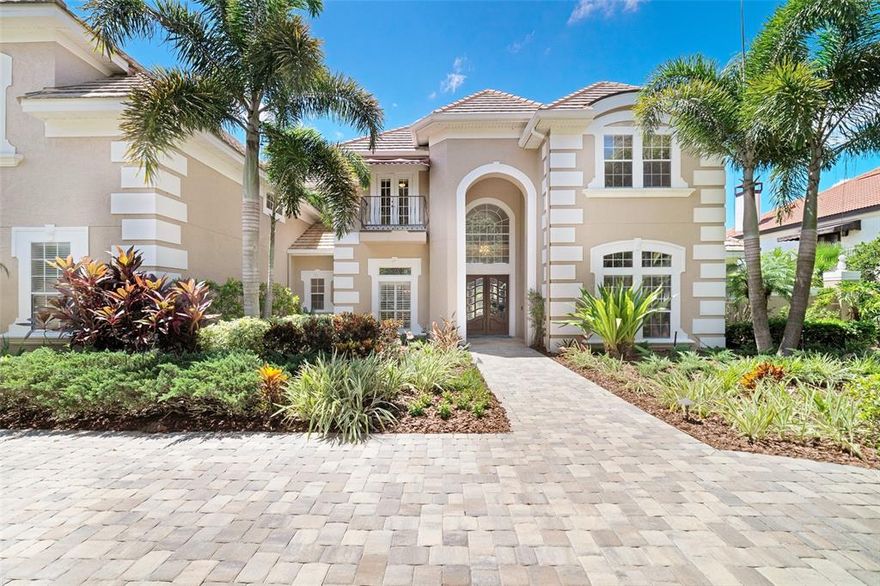 Chaine du Lac – one of Windermere’s most exclusive waterfront communities.  Enjoy the Butler Chain of Lakes from your own back yard with custom boathouse and 130’ of shoreline.  Amazing firework displays light up the evening sky..  Situated on a lushly landscaped one acre lot, this grand two story home was designed to accommodate an active lifestyle. The super floor plan features a formal living and dining room, home office with custom cabinetry and two bedroom suites on the first floor.  The primary bedroom suite includes a spacious sitting area, walk in closets and luxurious bathroom with jetted tub. The laundry room comes with ice maker and wine fridge. The gathering room boasts an island kitchen with a long breakfast bar plus a beverage bar. An entertainers delight with gas cooktop, double oven, warming drawer and sub zero refrigerator and freezer.  The space also allows for a sunny breakfast area and family room with stone fireplace which opens to the pool.  The 2nd level has 4 bedrooms, 3 baths, billiard room and media/exercise room.  Ample storage throughout includes a craft room with multiple uses, a secret hideaway and safe. The circular drive and side entry garage offers ample parking.  The enormous screened pool area is a garden retreat.  Relax in the tropical pool and spa or sit by the koi pond.  A separate summer kitchen cabana includes a pool bath, double gas grills and bar seating.  This home has been well loved for over 25 years.  Upgrades include Generac 70W whole house generator with 1,000 gallon propane tank, attic insulation and appliances.  The pool was rescreened and exterior was repainted.  New hardwood and marble flooring and carpet were installed in 2020.  A paver driveway was installed in 2021.  Conveniently located in the Town of Windermere with access to all town amenities.  Easy access to major roads, fine dining and premium shopping.  Renowned golf courses and area attractions are nearby.