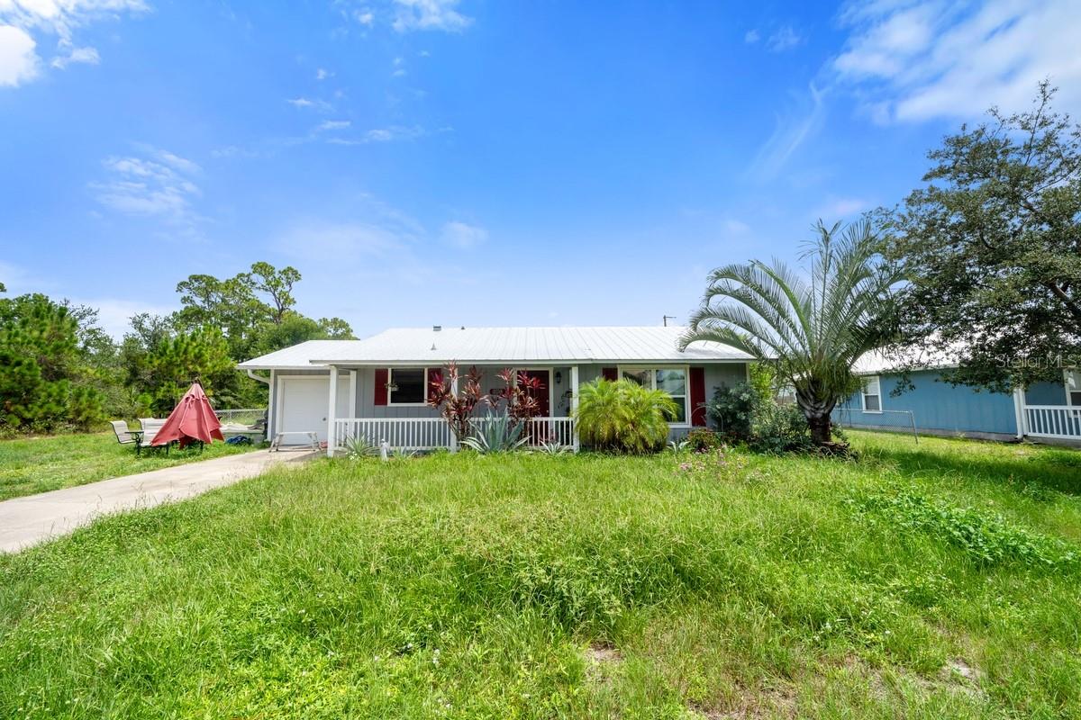 This beautiful corner-lot home is a spacious 2-bedroom, 2-bathroom property featuring a large kitchen with stainless steel appliances and generously sized bedrooms and bathrooms. The home boasts a brand new metal roof that's only a couple of years old, a 1-car garage, and a spacious backyard perfect for relaxing or entertaining. Conveniently located near shopping centers, schools, and just minutes from the beaches of Vero Beach.