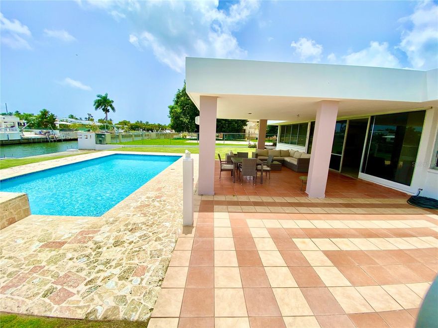 Located in one of the most exclusive communities in the metro area Vistamar Marina Este, this stunning waterfront home offers a private dock with direct access to a saltwater canal right in your backyard, perfect for boating, fishing, or enjoying serene views. Designed for luxury and comfort, the property features an expansive concrete terrace ideal for outdoor entertaining, a swimming pool with a view, a spacious open-concept layout seamlessly connecting the living, dining, and kitchen areas, and 4 bedrooms with 3 full bathrooms, including a master suite. With modern finishes and access to exclusive community amenities, this home perfectly blends elegance, convenience, and a vibrant coastal lifestyle. Open to offers!