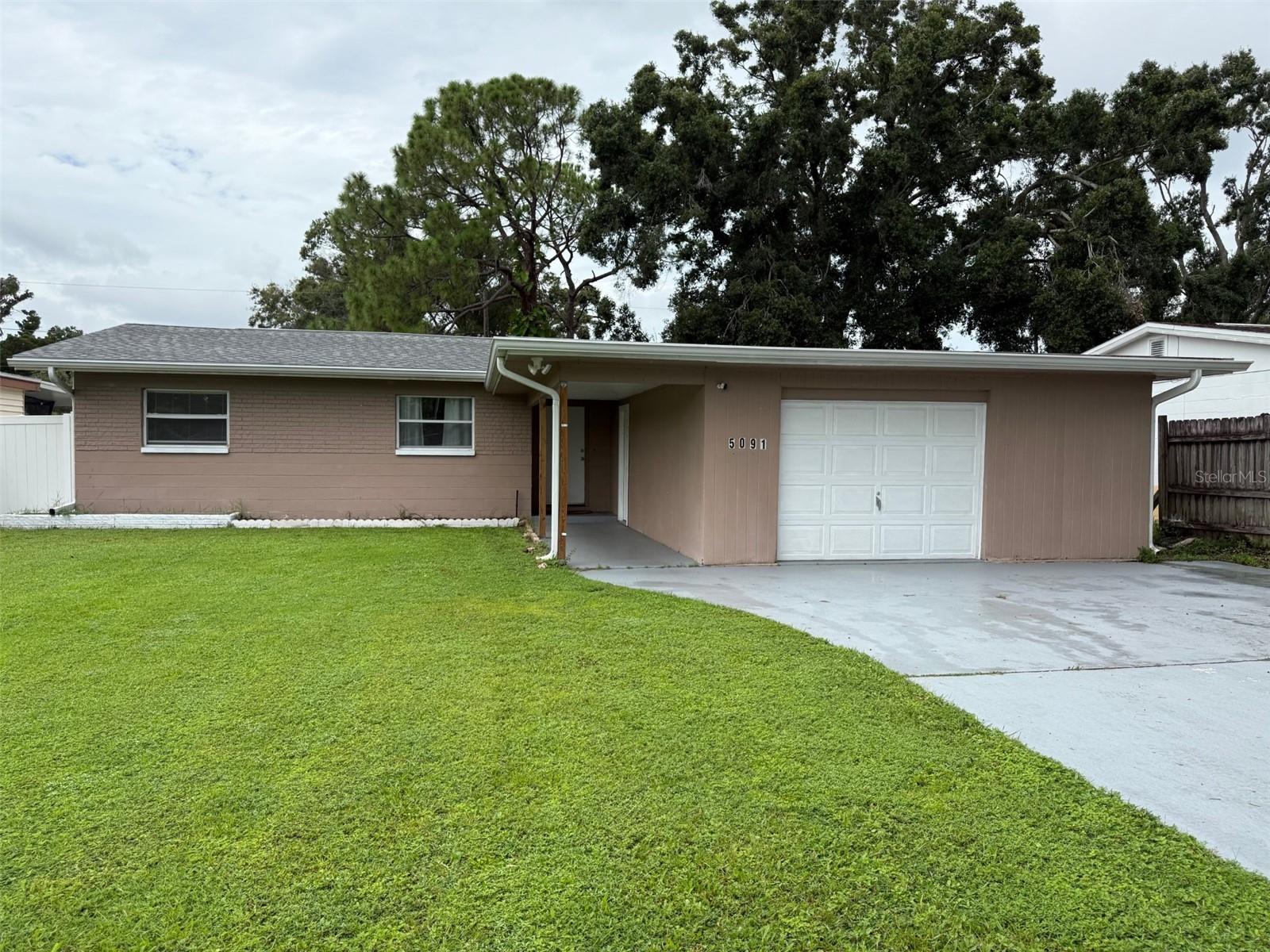 Excellent three bedro0m masonry home...Ready to move into,,,,Great convenient location...walk to all Stores....Fence Hugh back yard...Florida Room...1.5 car garage