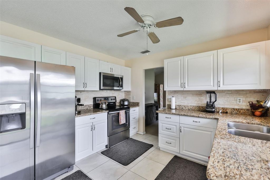 Photo of 1741 Atrium Drive, Sun City Center, FL 33573 (MLS # TB8505232)