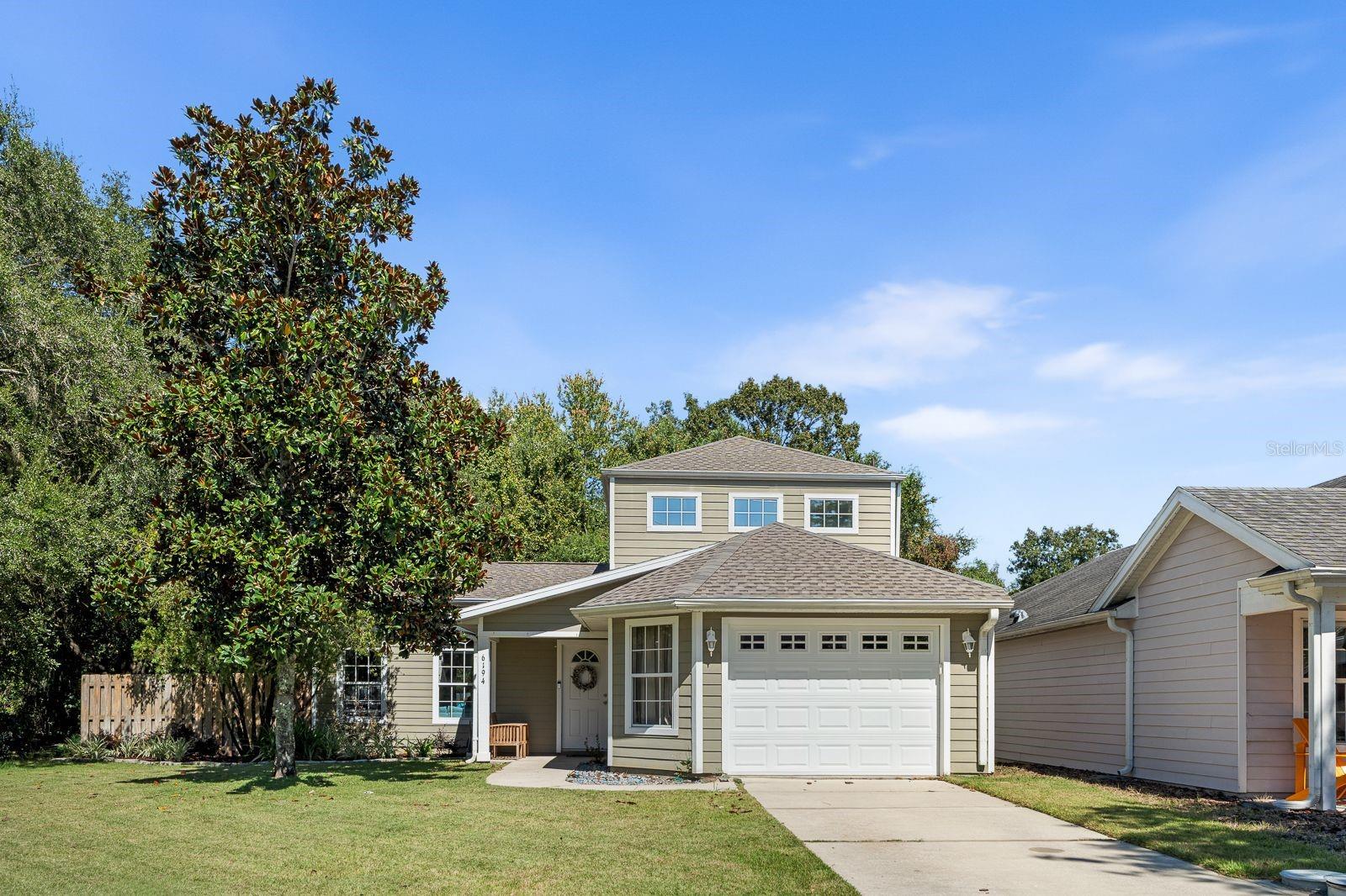 Live and play in the highly sought-after GATED golf course community of Turkey Creek! Enjoy an active lifestyle surrounded by nature with resort-style amenities including tennis courts, Pickleball courts, soccer, pool, playground, clubhouse, on site restaurant, community events, scenic walking and running trails. Just hitting the market is this beautiful and impeccably-kept two-story home in Creekside Villas- the only two-story in the neighborhood- sitting on a premium corner lot surrounded by open space and serene water views of a catch & release stocked pond! Phenomenal views from around the home. 2025 roof, 2018 Trane AC, 2018 water heater, 2020 stainless steel appliances, brand new luxury-vinyl floors in the great room and primary bedroom with $3000 credit towards new carpets upstairs- for your peace of mind! The bright and open floor plan is filled with natural light from the many windows and the screened-in back porch offers a peaceful retreat! The spacious primary suite is conveniently located downstairs with picturesque views and a beautifully updated bath featuring a frameless glass enclosure, garden tub and double vanities.Upstairs, the guest bedrooms are well-sized, each with views and a shared full bath. The kitchen offers crisp white cabinetry, SS appliances, pantry cabinet, lots of drawers and overlooking the dining room and spacious great room- ideal for entertaining. Additional features include blind inserts in French doors, rain gutters, a half bath, understairs storage, large utility area with laundry sink, updated sod and irrigation. You'll love living just minutes from Gainesville while enjoying this private, gated community that hosts fun events for its residents. BONUS, golf cart, extra fridge, washer/dryer convey! Experience the perfect blend of community, comfort and convenience--all with low HOA dues for everything it offers. Call today for your private viewing!