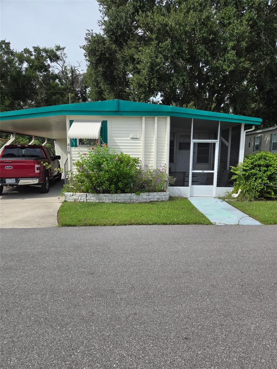 This mobile home sits in the Sky Harbor 55+ waterfront community in Clearwater. The home will be delivered vacant soon and is in overall decent condition, needing only light cosmetics such as paint and minor interior updates. The roof age is unknown, but no issues have been reported. A porch enclosure brings the interior living area to the mid-700s.
The community features a $295/month HOA which covers water, lawn mowing, and clubhouse access. Residents enjoy water access, but note there are rental restrictions in place. The property sits in Flood Zone X, so no flood insurance is required.