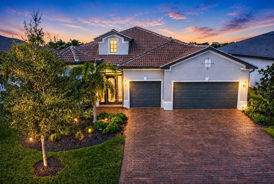 One or more photo(s) has been virtually staged. THIS HOME TRULY SHOWS LIKE A PERFECT, MOVE-IN READY MODEL HOME! Absolutely stunning and exceptionally welcoming, this CUSTOM-DESIGNED, meticulously maintained STONEWATER MODEL by DIVOSTA, move-in-ready residence is located in the gated, resort-style community of Islandwalk, one of Venice’s most desirable neighborhoods offering exceptional amenities and an active Florida lifestyle.
This beautiful, very spacious 3BD + OFFICE, 3BA, 3 CAR garage,with EXPANSIVE LANAI residence features a 2,855 SQ FT of heated thoughtfully designed living space with quality, comfort, and attention to detail in mind. The inviting open floor plan is filled with abundant natural light, generous room sizes that create a warm and welcoming atmosphere. CUL-DE-SAC location, one of the best in the whole Islandwalk commuity. NOT in the FLOOD ZONE. The expansive living and dining areas flow seamlessly to the extra-large screened lanai overlooking a tranquil water view with two picturesque bridges in the distance, providing the perfect setting for relaxing, entertaining, and enjoying Florida’s beautiful weather and stunning sunset views. The gourmet kitchen is beautifully appointed with tall real-wood cabinetry, quartz counters, built-in oven, stylish cooktop, KitchenAid appliances, and a walk-in pantry with custom gray built-in shelving offering exceptional storage and organization.The primary suite is a private retreat featuring a spa-like ensuite bath with walk-in shower and ample custom closet space. Two additional bedrooms and two full baths provide flexibility for guests or family. A generously sized office/den with abundant natural light offers versatility for working from home, study, or creative use. The designer laundry room includes custom cabinetry, expansive counter space, and outstanding organization—making everyday tasks effortless. Tile flooring throughout the living areas, kitchen, bathrooms, office, and laundry room, with quality engineered hardwood flooring in all bedrooms. THE HOME ALSO FEATURES IMPACT WINDOWS AND SLIDERS THROUGHOUT, STORM SMART HURRICANE SHUTTERS ON THE LANAI, AN EXTRA-STRONG LANAI STRUCTURE WITH REINFORCED CONSTRUCTION AND SCREENING, ADDITIONAL ATTIC INSULATION FOR ENHANCED ENERGY EFFICIENCY, A CENTRAL VACUUM SYSTEM, EPOXY FLOORING IN THE GARAGE, ELEGANT COFFERED CEILINGS IN THE LIVING ROOM, TRAY CEILINGS IN THE PRIMARY BEDROOM, OFFICE, AND ONE GUEST BEDROOM, CROWN MOLDING THROUGHOUT, A SEALED PAVER DRIVEWAY ENHANCING CURB APPEAL. 3-car garage offers room for multiple vehicles, a golf cart, or extra storage. Residents of IslandWalk at the West Villages enjoy access to two resort-style amenity centers, featuring grand clubhouses, resort and lap pools, two hot tubs, fitness centers, 12 pickleball courts,8 tennis courts,bocce courts,basketball court,walking and biking trails, waterfront parks, dog park, playground, community garden, nature preserve, and a vibrant calendar of social activities.Ideally located just minutes from world-famous Gulf beaches, shopping, dining, entertainment, medical facilities, and top-rated schools. The home is also conveniently close to Wellen Park, Venice’s beautifully designed new downtown destination offering upscale dining, boutique shopping, entertainment, and year-round community events.This stunning home shows like a model and offers an exceptional Florida lifestyle. Everything you’ve been searching for is right here. Schedule your private showing today—and be sure to explore the 3D tour and video!