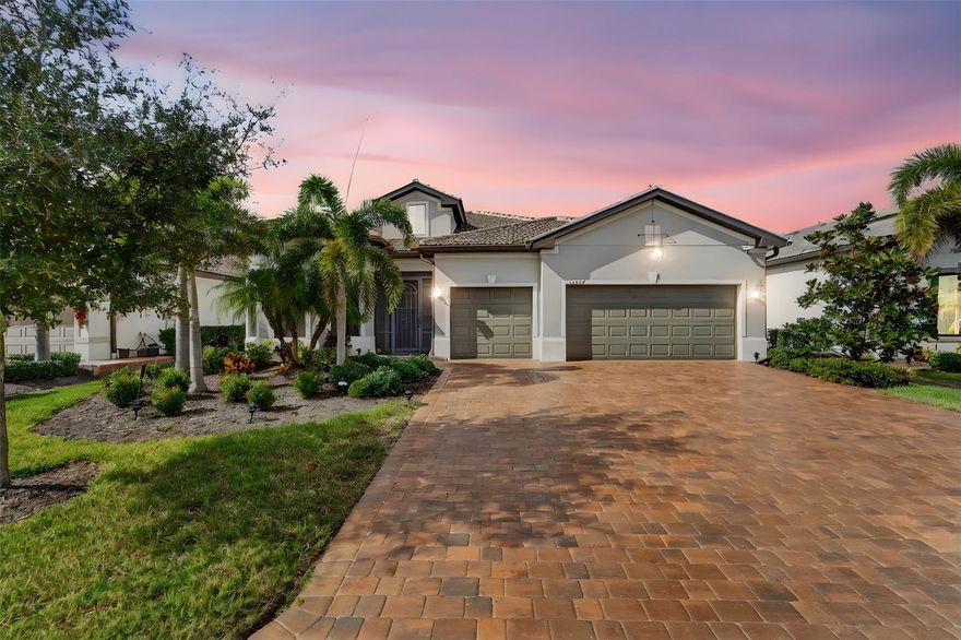 THIS HOME IS A MUST SEE! Absolutely stunning and exceptionally welcoming, this custom-designed, meticulously maintained, move-in-ready residence is located in the gated, resort-style community of IslandWalk at the West Villages, one of Venice’s most desirable neighborhoods offering exceptional amenities and an active Florida lifestyle.



This spacious 3-bedroom plus office/den, 3-bath, 3-car garage single-family home features 2,855 square feet of thoughtfully designed living space and was built in 2019 with quality, comfort, and attention to detail in mind. The inviting open floor plan is filled with abundant natural light, generous room sizes, and open sightlines that create a warm and welcoming atmosphere.



The expansive living and dining areas flow seamlessly to the extra-large screened lanai overlooking a tranquil lake, providing the perfect setting for relaxing, entertaining, and enjoying Florida’s beautiful weather and stunning sunset views. The gourmet kitchen is beautifully appointed with tall real-wood cabinetry, built-in oven, stylish cooktop, KitchenAid appliances, and a walk-in pantry with custom gray built-in shelving offering exceptional storage and organization.



The primary suite is a private retreat featuring a spa-like ensuite bath with walk-in shower and ample custom closet space. Two additional bedrooms and two full baths provide flexibility for guests or family. A generously sized office/den with abundant natural light offers versatility for working from home, study, or creative use. The designer laundry room includes custom cabinetry, expansive counter space, and outstanding organization—making everyday tasks effortless.



Additional highlights include tile flooring throughout the living areas, kitchen, bathrooms, office, and laundry room, with quality engineered hardwood flooring in all bedrooms. The home also features impact windows throughout, electric hurricane shutters on the lanai, elegant coffered ceilings in the living room, tray ceilings in the primary bedroom, office, and one guest bedroom, crown molding throughout, and a beautifully sealed paver driveway enhancing curb appeal. The spacious 3-car garage offers room for multiple vehicles, a golf cart, or extra storage.



Residents of IslandWalk at the West Villages enjoy access to two resort-style amenity centers, featuring grand clubhouses, resort and lap pools, two hot tubs, fitness centers, 12 pickleball courts, 8 tennis courts, bocce courts, basketball court, walking and biking trails, waterfront parks, dog park, playground, community garden, nature preserve, and a vibrant calendar of social activities.



Ideally located just minutes from world-famous Gulf beaches, shopping, dining, entertainment, medical facilities, and top-rated schools. The home is also conveniently close to Wellen Park, Venice’s beautifully designed new downtown destination offering upscale dining, boutique shopping, entertainment, waterfront spaces, and year-round community events.



This stunning home shows like a model and offers an exceptional Florida lifestyle. Everything you’ve been searching for is right here. Schedule your private showing today—and be sure to explore the 3D tour and video!