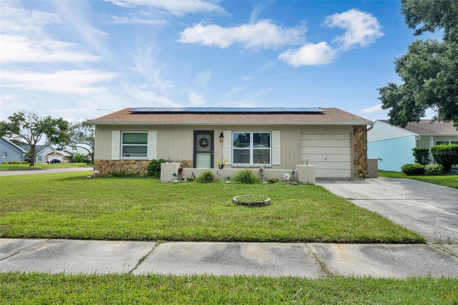 Welcome to this beautifully updated Pinellas Park with a Clearwater address. . All updated new home. New roof, windows, and air conditioning. Updated bathroom. Additional square footage with laundry room and Additional room. This room can be used as office, storage or an additional bedroom. No window so cannot be called a bedroom. Community pool 5 houses down. New flooring completely updated kitchen with quartz countertop in kitchen and dining area.
