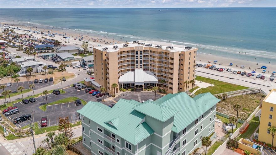DIRECT OCEANFRONT CONDO – TURNKEY INVESTMENT & COASTAL RETREAT! Experience elevated beachside living in this direct oceanfront 2BR/2BA residence at Oceania Beach Club, where panoramic Atlantic views and effortless elegance define every day. Positioned on the 3rd floor with convenient elevator access, this beautifully maintained condo features a private balcony perfect for sunrise mornings, along with floor-to-ceiling sliding glass doors that fill the space with natural light. The kitchen is thoughtfully appointed with granite countertops, stainless steel appliances, and bar seating, opening to a bright and inviting living area designed for comfort and relaxation. The oceanfront primary suite offers a serene retreat, while both bathrooms have been tastefully updated. Accommodating up to 4 guests, this property is ideal for personal enjoyment or as a high-performing investment with no rental restrictions. Residents enjoy resort-style amenities including a heated pool, grilling area, direct beach access, and a welcoming lobby with lounge and game space. Just a short stroll to Flagler Avenue’s dining, boutiques, and vibrant events, and conveniently located within easy reach of regional airports, world-class attractions, natural parks, and popular local destinations. A turnkey opportunity to own a piece of New Smyrna Beach’s most desirable oceanfront lifestyle. A/C approx. 2 years old.
