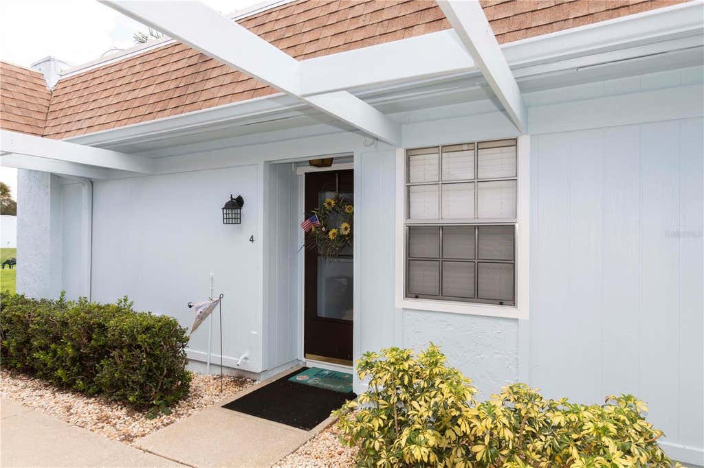 Photo of 11140 Carriage Hill Drive #4, Port Richey, FL 34668 (MLS # W7888376)