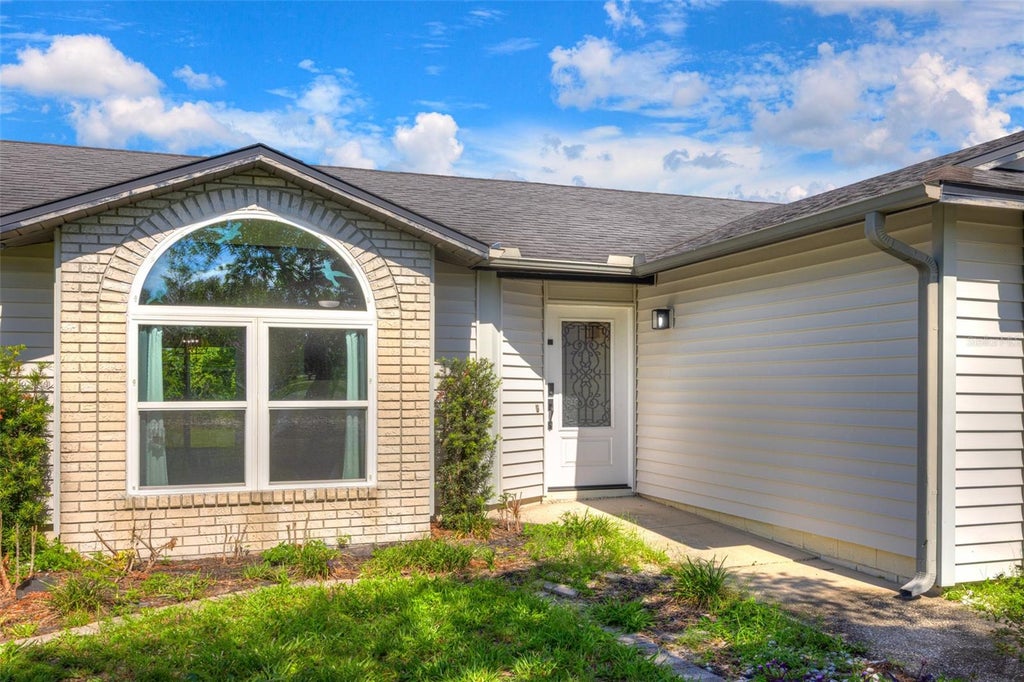 Photo of 710 Alexander Avenue, Deltona, FL 32725 (MLS # V4949702)