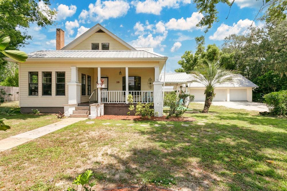 Charming retreat on nearly half an acre in Avon Park! Welcome to this beautifully 4-bedroom, 2-bathroom craftsman-style home nestled on a spacious lot in the heart of Avon Park. With a perfect blend of character, space, and functionality, this two-story gem is designed for both comfort and versatility. Step onto the inviting front porch and into an open-concept living space where the living and dining areas flow seamlessly together, anchored by a cozy wood-burning fireplace. Soaring vaulted 10-foot ceilings with detailed crown molding and rich hardwood floors elevate the warmth and elegance of the main level. The kitchen features a convenient breakfast bar, ideal for casual dining and entertaining. A dedicated office space offers a quiet retreat for working from home or creative projects. Upstairs, a bonus loft area separate from the primary bedroom comes with a private exterior staircase. Outside, the large backyard is a private oasis, fully fenced and with a charming tree house. The detached three-car garage over 1008 sq ft, complete with a metal roof, 100-amp service, and extensive storage, provides the ideal space for hobbies, vehicles, and more. Whether you're looking for a family-friendly home or a one-of-a-kind property with room to grow, this Avon Park beauty has it all!