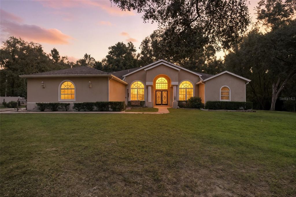 Photo of 4060 S Kenvera Loop, Inverness, FL 34450 (MLS # O6362556)