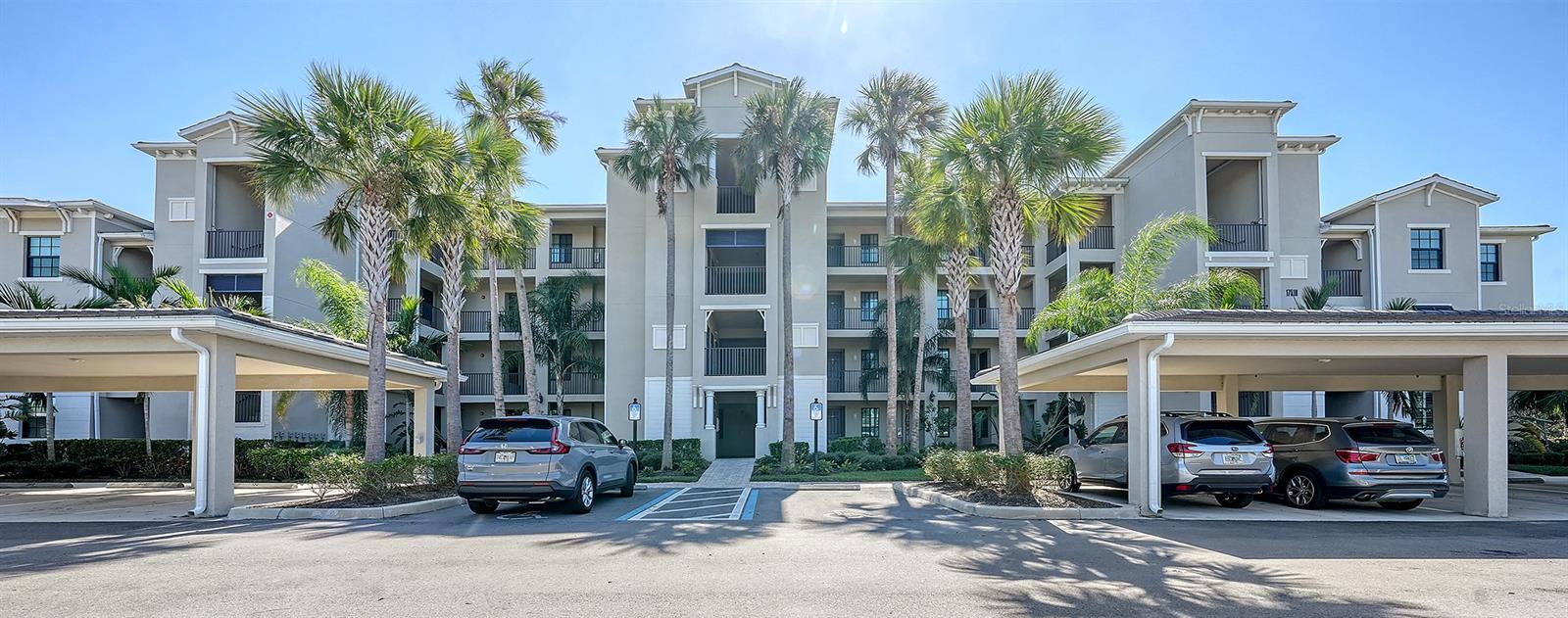 Discover your dream home in this stunning, fully furnished unit at the prestigious Lakewood Ranch Golf and Country Club! Indulge in luxury and embrace a lifestyle of unparalleled comfort and elegance, surrounded by world-class amenities and resort-style living. As you step inside, you'll be captivated by the bright, open floor plan adorned with exquisite 16-inch tile and soaring 10-foot ceilings accented by crown molding. The gourmet kitchen is a chef's paradise, featuring elegant quartz countertops, stylish wood shaker cabinets, top-of-the-line stainless steel appliances, and an expansive breakfast bar paired with a central island—perfect for entertaining and culinary creations. Relax in the inviting living room, where sliding glass doors open to a screened-in lanai, offering idyllic views of a serene lake and the 15th hole of the Piper Golf Course. The owner's suite is a true sanctuary, complete with breathtaking lake vistas, two generous walk-in closets, and a spa-like ensuite bathroom featuring a glass-enclosed shower. The thoughtfully designed split floor plan ensures privacy for every bedroom, making it an ideal retreat for you and your guests. This remarkable unit also includes a reserved carport, a convenient storage closet, and the assurance that it has never been leased. At Lakewood National Golf & Country Club, you’ll experience a lifestyle like no other, with access to 36 holes of championship golf designed by Arnold Palmer, tennis courts, a state-of-the-art fitness center, eight sparkling satellite pools, a luxurious spa, pickleball courts, exquisite dining options, and a dedicated lifestyle director—all just steps from your front door. Could this be the home you've been searching for? Don’t wait—schedule your showing today and take the first step towards your extraordinary new lifestyle!
