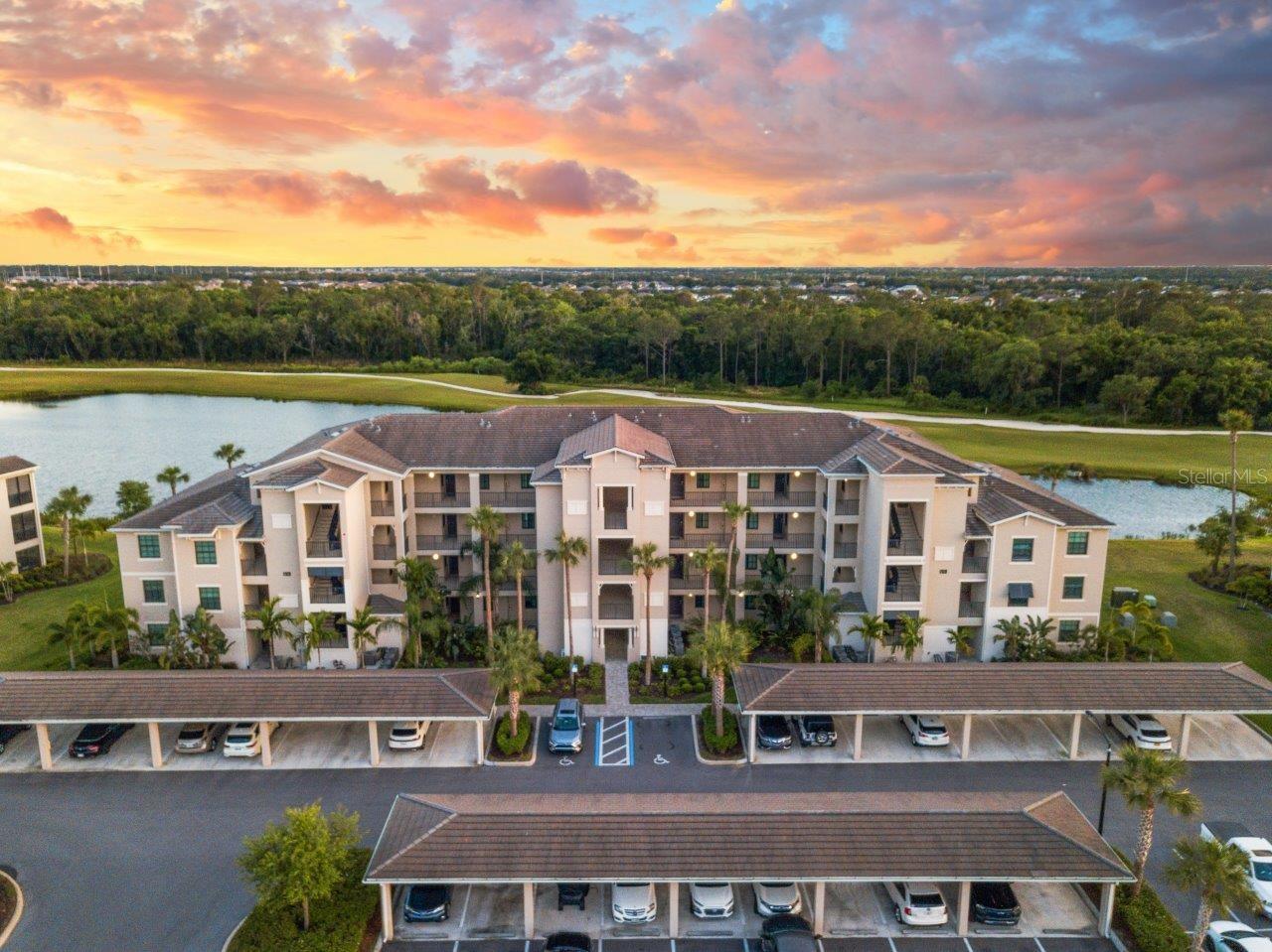 This Unit Comes Turnkey Furnished! Experience luxurious living in this highly sought-after Golf and Country Club in Lakewood Ranch, where World-Class Amenities and Resort-Style Living await you. Upon entering, you'll be greeted by a perfectly illuminated open floorplan featuring 16" tile throughout the main living areas, 10’ ceilings, crown molding, and more. The gourmet kitchen boasts quartz countertops, wood shaker style cabinets, stainless steel appliances, a spacious breakfast bar, and an island. In the living room you can catch the sunrise and sunset through the sliding glass doors from the screened-in lanai, overlooking a beautiful lake and the 15th hole of the Piper Golf Course. The owner's suite includes stunning lake views, two walk-in closets, and an ensuite bathroom with a glass enclosed shower. The split floorplan offers privacy for each of the bedrooms, creating a comfortable environment for your guests. Additional bonus's this unit has is a reserved carport spot, a storage closet, and the unit has never been leased. Lakewood National Golf & Country Club offers a true resort lifestyle that includes 36 holes of championship golf designed by Arnold Palmer, tennis courts, fitness center, 8 satellite pools including a resort style pool at the club house, spa, pickleball courts, restaurants, a full-time lifestyle director, and more! All just a short distance from your doorstep. Is this home your perfect match? Schedule a showing today!