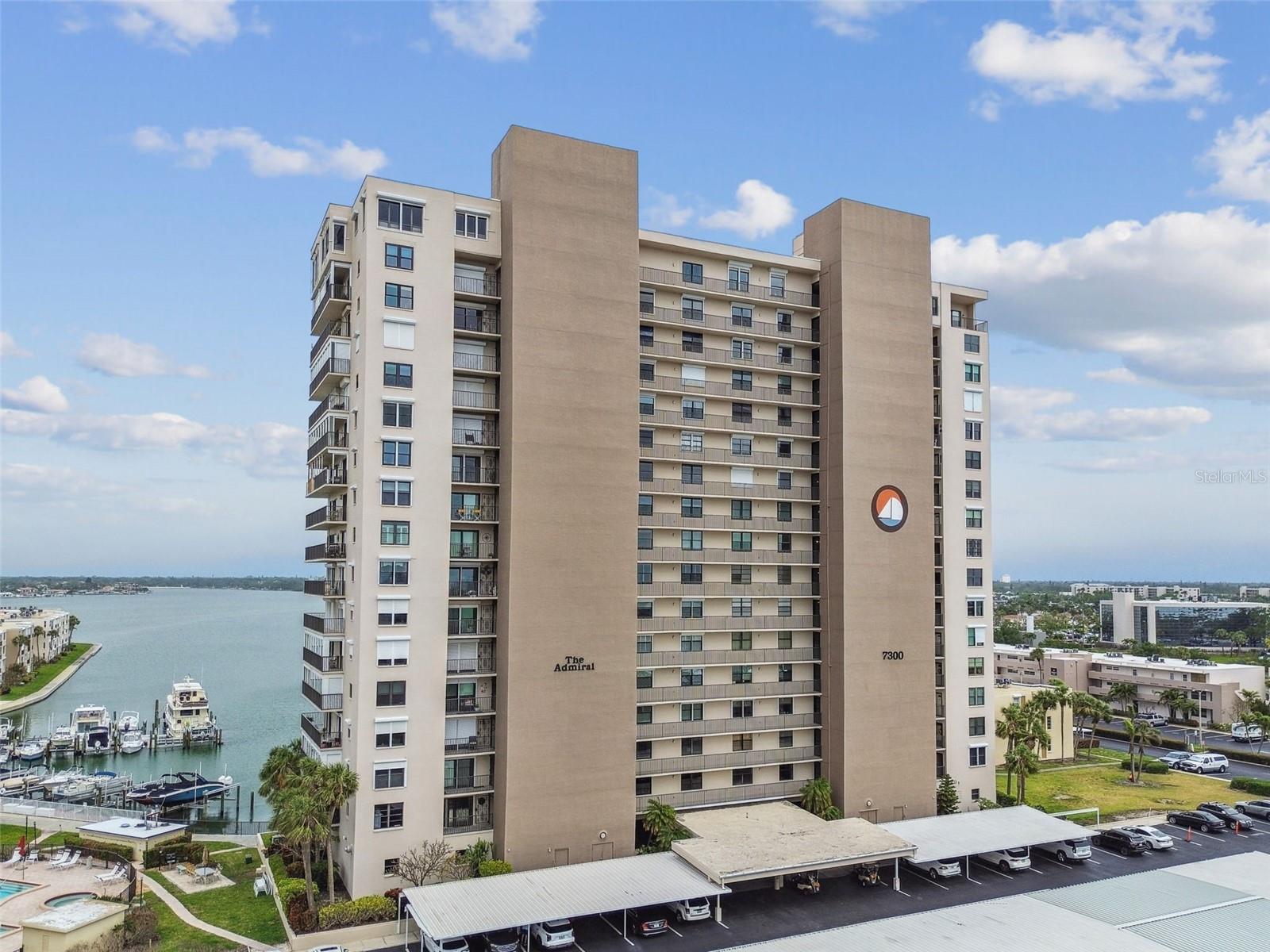 ***HUGE PRICE IMPROVEMENT***Come see this SPECTACULAR LUXURY WATERFRONT CONDO with AMAZING DIRECT VIEWS of the BOCA CIEGA BAY. Life is Great when you’re living in Paradise at the meticulously maintained Bay Island community. It’s a gated community with 24/7 security personnel. This gorgeous FULLY REMODELED unit is located in the center of the commanding 18-story ADMIRAL building. It has 1,120 square feet of open floor plan. As you walk in, you’ll be drawn to the Living Room and views of the Intracoastal waters below. The Kitchen was remodeled with high-end solid-wood cabinets, stainless steel appliances and Cambria Quartz countertops. The Bedroom Ensuite has a gorgeous full ensuite bath and a large Walk-In Closet. Flooring in the Bedroom is real hardwood engineered oak while the rest of the condo has Italian porcelain tile. Add your own Murphy Bed in the Living Room and invite friends and family for a sleepover. Recessed Lighting is furnished throughout using energy-saving LED bulbs. A Guest Bath and in-unit Laundry WASHER & DRYER completes the interior floor plan. Step outside to the BALCONY to soak in the awesome Florida sunshine and enjoy the magnificent views beyond. All the windows and sliding Balcony doors are hurricane-rated with impact glass for a high level of protection. There’s a shared STORAGE ROOM and a dedicated STORAGE SHED for your personal use. Your assigned covered parking spot is only a few steps away in front of the building’s entrance. The Bay Island community is a very active community for residents 55 years YOUNG or above. It boasts 6 Swimming pools, 2 Hot Tubs, Tennis and Pickleball courts, separate men and women Fitness Centers with locker rooms, a Clubhouse with party rooms and billiards and ping-pong, a Library and a full calendar of social events. There’s also an on-site Marina for your boat. The world-class Gulf Beaches of St Pete Beach, Treasure Island, Madeira Beach and Clearwater Beach are only minutes away and the famed Sunday Corey Ave Market is a stone’s throw across the iconic drawbridge. Come and enjoy the many beach bars with live bands or dine at the immense variety of restaurants that suit your culinary taste. Downtown St. Petersburg is only a short drive where you can experience the many museums, theaters, parks, marinas, sidewalk dining, and cultural events – or come watch the Tampa Bay Rays play baseball and the Rowdies in a soccer match. Tampa International Airport (TPA) and the Clearwater-St Pete Airport (PIE) are about 30 minutes away. Small PETS ALLOWED. The Milestone Report and Structural Integrity Reserve Study are complete and no substantial structural repairs were reported. So come and enjoy life at this relaxing Waterfront Paradise with a Peace of Mind. ***Virtual Tour Video and Matterport Interactive Walkthrough available***
