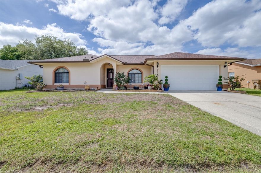 This warm and inviting home has been lovingly cared for by the same owner for over 20 years, showcasing true pride of ownership. Featuring a new AC (2019), roof (2016), water heater (2015), updated kitchen (2016), and beautiful wood-grain style tile flooring throughout. The home offers tons of natural light, rain gutters, and a spacious split-bedroom layout for excellent privacy. The huge master suite includes a large walk-in shower, while the second bathroom has a tub/shower combo. Outside, enjoy a stunning crystal-blue oversized pool, generous outdoor deck, and a large fully fenced backyard with vinyl fencing — perfect for relaxation and gatherings. Additional highlights include a 2-car garage, no CDD fees, and low monthly HOA in the desirable Association of Poinciana Villages. Nestled on a quiet cul-de-sac in a wonderful family-friendly neighborhood, this charming home is just minutes from schools, parks, and shopping. Conveniently located only 40 minutes to Walt Disney World and within 20 miles of Orlando. A perfect blend of comfort, style, and Florida living!
