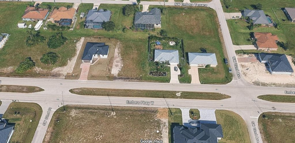 Photo of 2211 Embers Parkway W, Cape Coral, FL 33993 (MLS # O6367199)