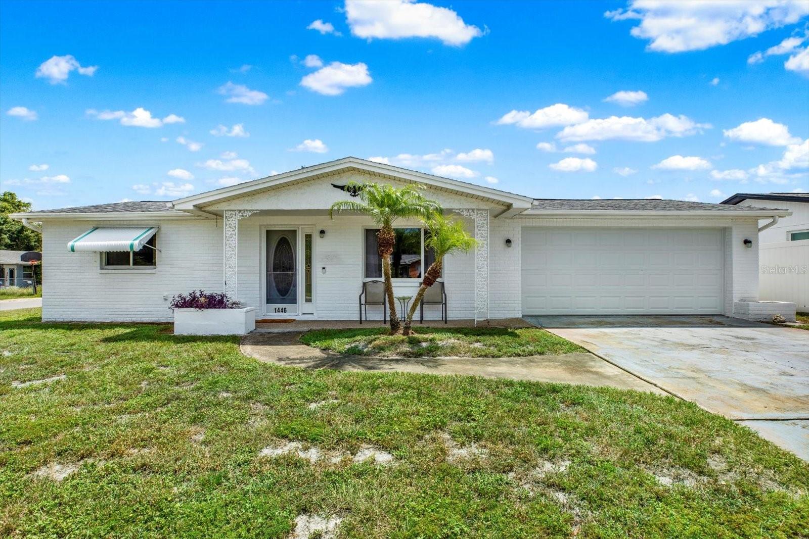 Holiday Lake Estates home on a corner lot with chain link fencing securing your backyard is waiting for you! This 2 bedroom 2 bath home has a roof only 8 months old and has been freshly painted on the exterior! Vinyl flooring flows throughout the home giving it a seamless look. The back of the house has a Florida Room and a Sun Room. The Sun Room can be used as an office or as a quiet retreat when you need to relax. The fenced yard has a large gate enabling you to park your various toys inside the fence. Being close to the beach and to the Tarpon Springs Sponge Docks makes it a fabulous location. The best thing is no HOA! Come check out your new home today!
