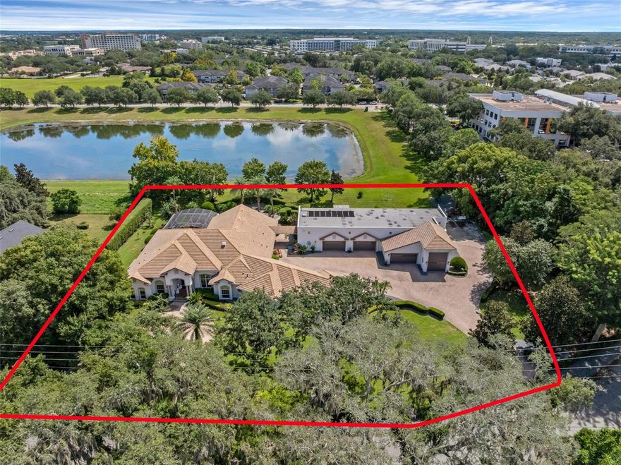Live the Heathrow Lifestyle—Without the HOA!

Welcome to one of the most extraordinary custom-built estate homes in the heart of the Lake Mary/Heathrow area. This rare opportunity offers the prestige of Heathrow living without the fees, tucked away in a private, park-like setting just steps from International Parkway and Colonial Town Park.

Boasting an impressive 12,842 total square feet, this estate is designed for those who demand space, privacy, and unforgettable features. The main home spans 4,361 square feet with 4 bedrooms, 3.5 bathrooms, and a 5-car garage, offering an elegant and functional layout for everyday living. In addition, the detached building encompasses 8,481 square feet, complete with a full bath, multiple half baths, a 6-car garage, and 2 RV garages—making it a dream for car collectors and recreation enthusiasts alike.

Luxury details abound, including a natural gas-powered backup generator and a 2019 Signature Kitchen remodel by Lake Mary’s own Signature Kitchen, blending style and function at the heart of the home.

Car collectors and recreation enthusiasts will fall in love with the “Garage Mahal,” providing the ultimate showcase and storage space for all your toys. The lushly landscaped grounds set the stage for resort-style living. A tropical oasis awaits in the backyard, where a rock waterfall pool and expansive lanai create the perfect retreat. Entertain year-round in style with a full-size Thermador outdoor kitchen, built for hosting family and friends.

Inside, luxury continues with a state-of-the-art private home theater, valued at $400,000, that rivals and outperforms commercial cinemas. Whether it’s movie night, game day, or family gatherings, this one-of-a-kind feature takes entertainment to the next level.

With its unmatched size, design, and amenities, this “Home Extraordinaire” is truly one of the most unique estates available on the market today. Don’t miss your chance to own a property that blends lifestyle, location, and luxury in one remarkable package.