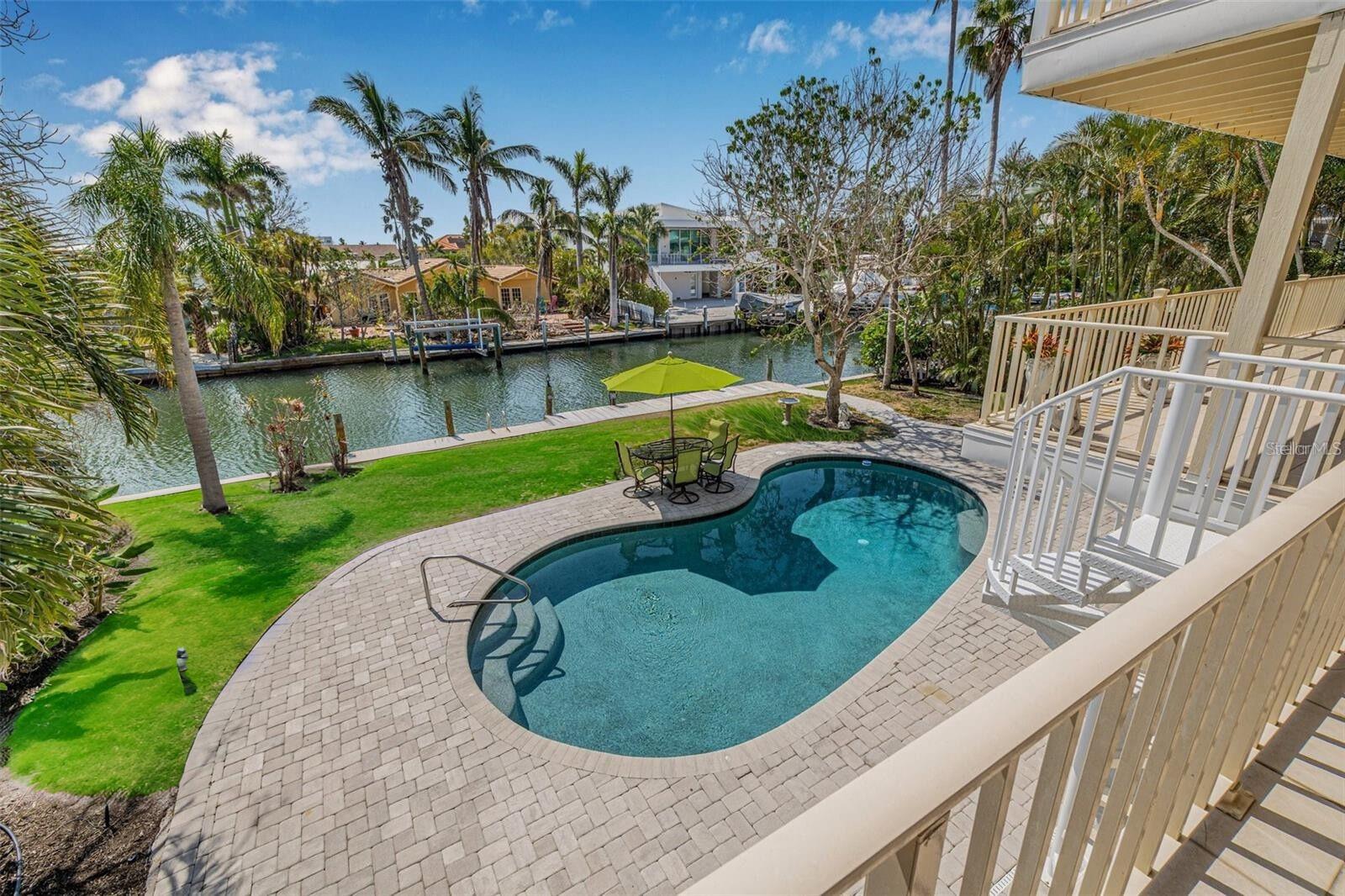Discover the perfect blend of luxury, creativity, and coastal living in this expansive Longboat Key residence. Situated on a deep water canal with a private dock, this solid block construction home offers direct access to the Gulf and is ideal for boating enthusiasts. A rare four-car garage provides ample space for vehicles, toys, and storage.
Inside, you’ll find an extraordinary gourmet kitchen designed for serious chefs—featuring six gas burners, a built-in griddle and grill, high-end appliances, and generous prep space for entertaining.
What truly sets this home apart are the hand-painted interior walls, created by Hahn, a local St. Petersburg artist, giving each room a distinct personality and sense of place. A private elevator provides easy access across the multi-level layout, while the rear of the home is lined with balconies—creating seamless indoor-outdoor living and offering tranquil views of the canal and pool.
Whether you’re looking for a full-time residence or a show-stopping vacation home, this property delivers the best of Longboat Key living: space, style, and sailboat water access in one unforgettable package. This property would make the perfect corporate home. The house can easily sleep 20 people.