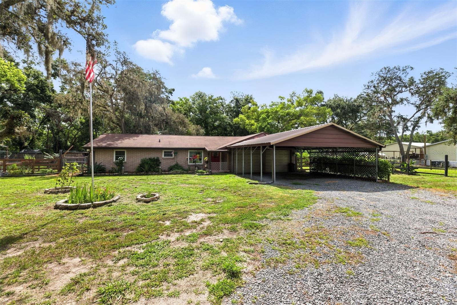 Mini Farm Magic in Zephyrhills! Welcome to 4244 Ryals Road, where charm meets country convenience! This beautifully updated mini farm is bursting with character and modern touches – all tucked away on a peaceful slice of paradise in the heart of Zephyrhills. Step into a freshly upgraded farmhouse with all the cozy vibes you crave and the sleek features you deserve. Recent updates include a modern kitchen, updated flooring, updated electric in 2022, new windows and AC in 2017, new roof 2016, new drain field and water heater less than 1 year old! Outside, you'll find plenty of room to roam, grow, and gather! The property features fenced pastures, animal enclosures, and a storage shed – perfect for goats, chickens, or other little critters. Grow your own produce, host weekend bonfires, or just soak in the sunset with a cold glass of sweet tea. Whether you're dreaming of a hobby farm, weekend retreat, or everyday escape, this gem is move-in ready and full of possibility. No HOA, plenty of space for RVs, boats, or tractors, and all the updates are already done for you! Bring your boots and your big dreams – this mini farm is ready for its next chapter!