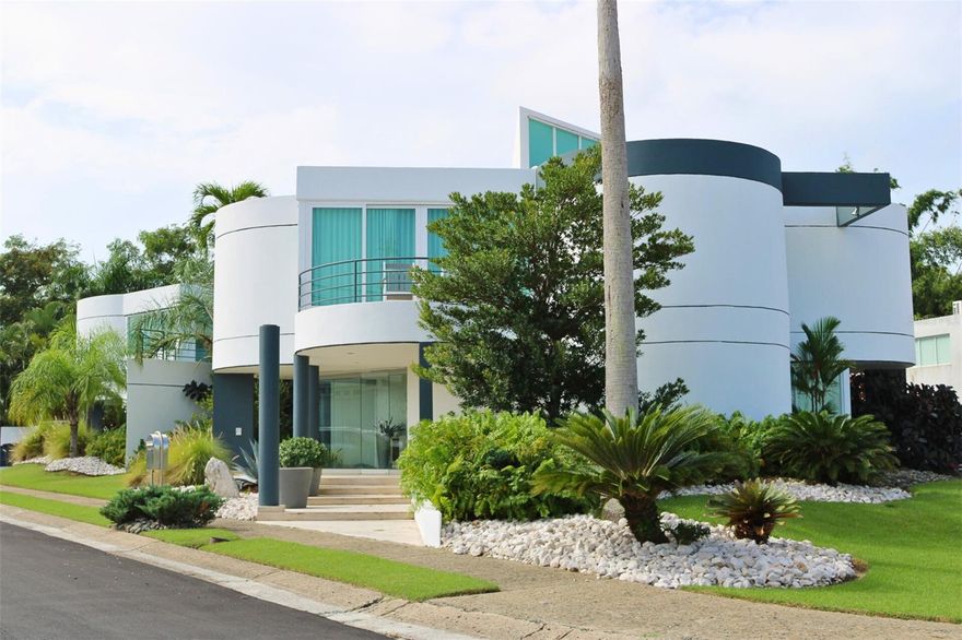 Welcome to this stunning corner residence located in the prestigious Monte Olimpo, an exclusive enclave within the Alto Apolo gated community. Nestled on a quiet cul-de-sac street, this property offers the perfect combination of privacy and sophistication. Sitting on a 1,014 m² lot and offering approximately 6,000 sq. ft. of living space, this home perfectly blends luxury, comfort, and functionality.
Featuring five spacious bedrooms and five full bathrooms, this elegant property offers a welcoming foyer, a family room, a gym/activity room, a laundry room, and state-of-the-art appliances throughout.
Designed for entertainment and relaxation, the home features a large covered terrace with a BBQ area, an open terrace on the second level, and a beautiful pool with a waterfall surrounded by a generous backyard — spacious enough to host weddings, family gatherings, or other special events.
Additional highlights include a four-car garage, a power generator, a low HOA fee of just $80 monthly, and annual property taxes of $4,606.
Experience privacy, elegance, and tranquility in one of the most desirable communities in the area — Monte Olimpo.