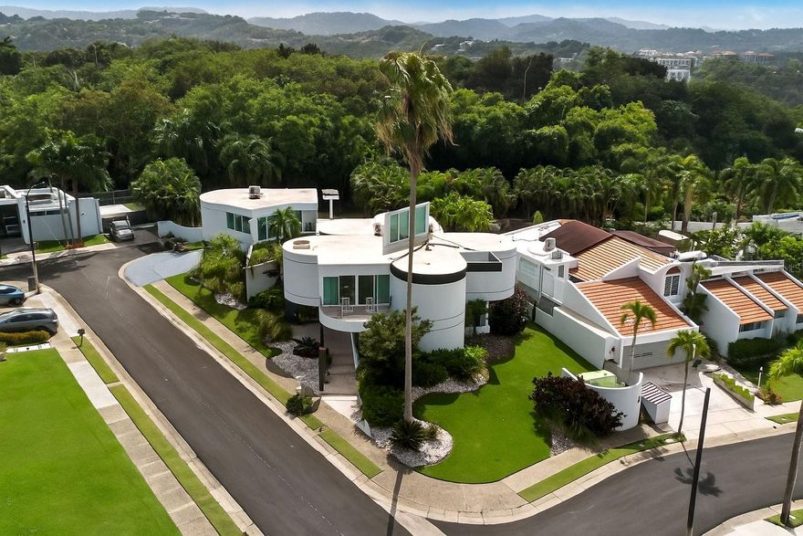 Welcome to this stunning corner residence located in Monte Olimpo, an exclusive enclave within the Alto Apolo gated community. Nestled on a quiet cul-de-sac street, this property offers the perfect combination of privacy and sophistication. Sitting on a 1,014 m² lot and offering approximately 3,733 sq. ft. of living space, this home perfectly blends luxury, comfort, and functionality.

Featuring five spacious bedrooms and five full bathrooms, this elegant property offers a welcoming foyer, a family room, a gym/activity room, a laundry room, and state-of-the-art appliances throughout.

Designed for entertainment and relaxation, the home features a large covered terrace with a BBQ area, an open terrace on the second level, and a beautiful pool with a waterfall surrounded by a generous backyard — spacious enough to host weddings, family gatherings, or other special events.

Additional highlights include a four-car garage, a power generator, a low HOA fee of just $80 monthly, and annual property taxes of $4,606.

Experience privacy, elegance, and tranquility in one of the most desirable communities in the area — Monte Olimpo.