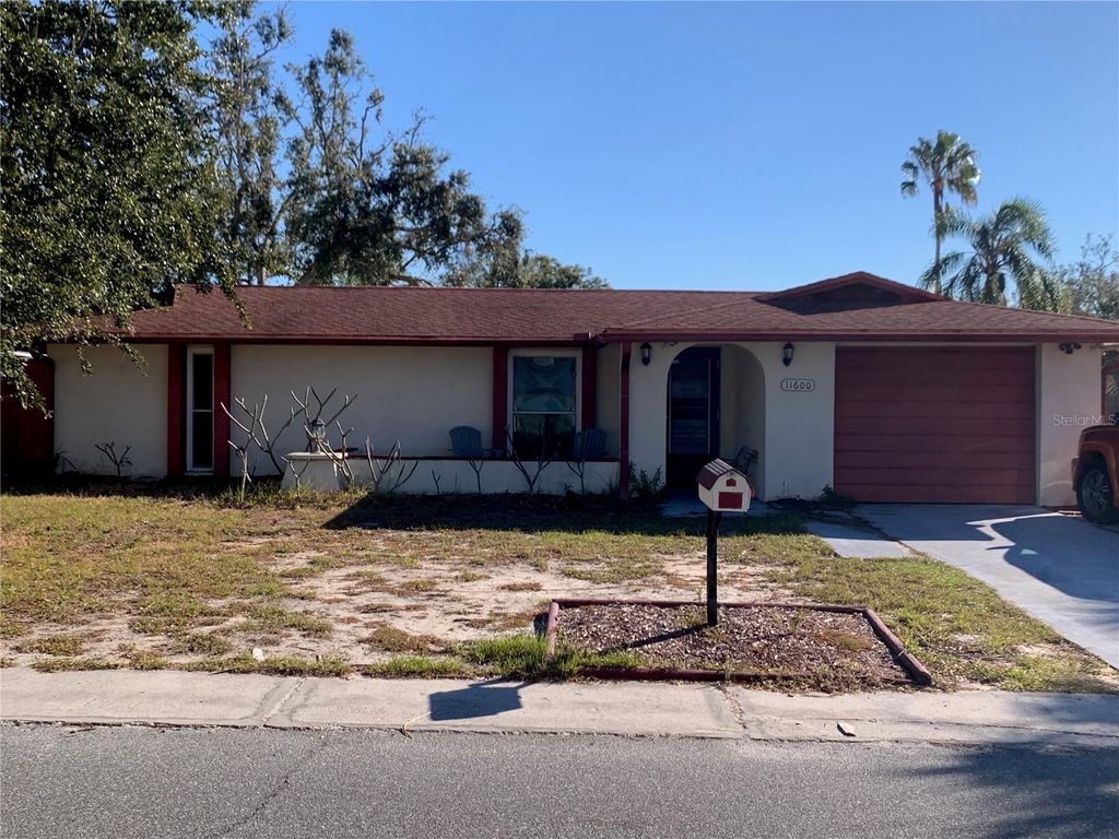 Photo of 11600 Crystal Lake Drive, Port Richey, FL 34668 (MLS # TB8379590)