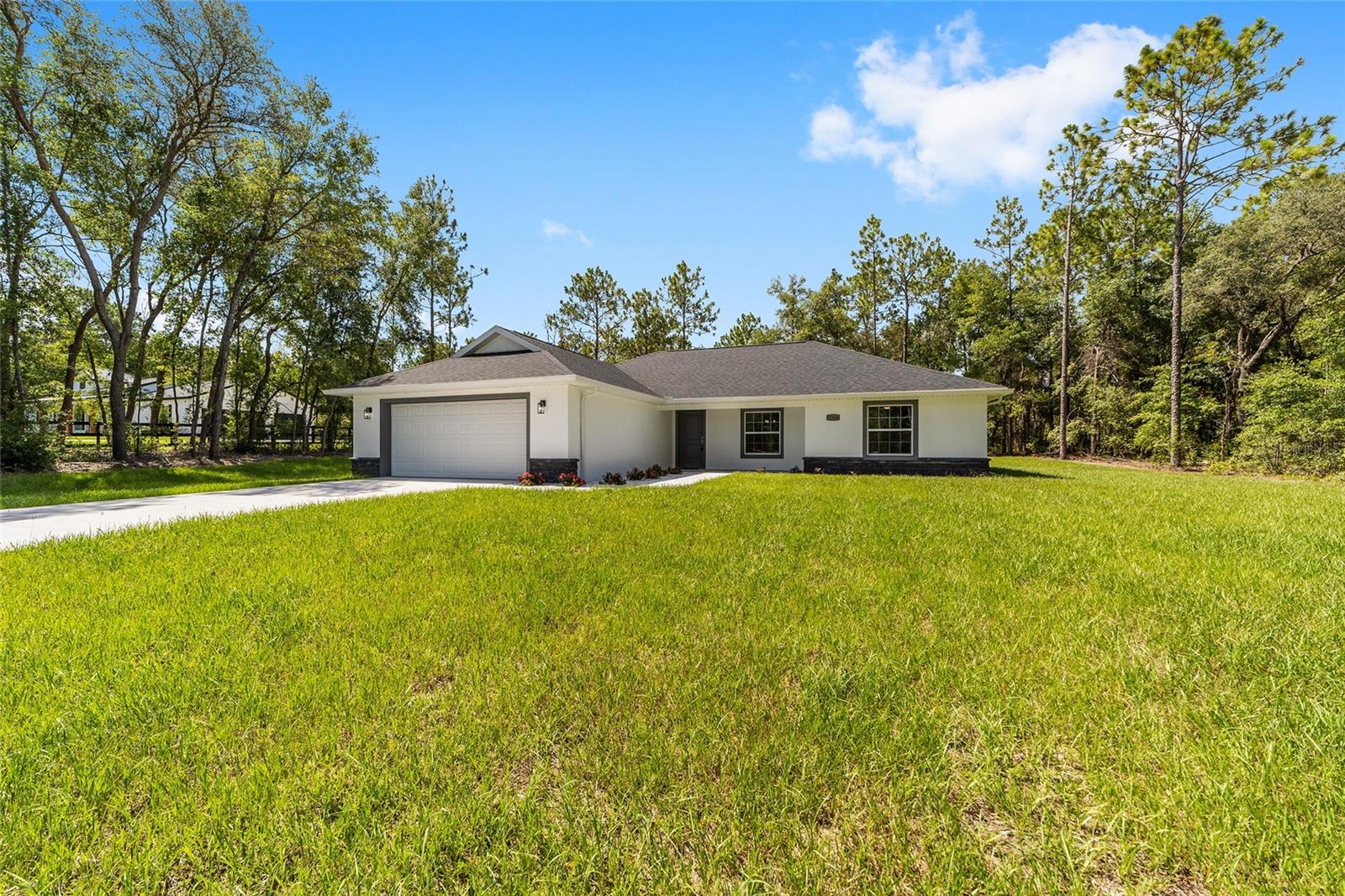 Brand new 3-bedroom 2 bath home on a paved road in Rolling Hills on 1.14 acres. Rolling Hills is located close to The World Equestrian Center. Upgrades throughout the home. There is room for an outbuilding. Conventional financing will be considered with a 4% deposit under cash terms. Shown by appointment. A builder's warranty plan is included. Pick a refrigerator at Setzer's with a $1600.00 allowance