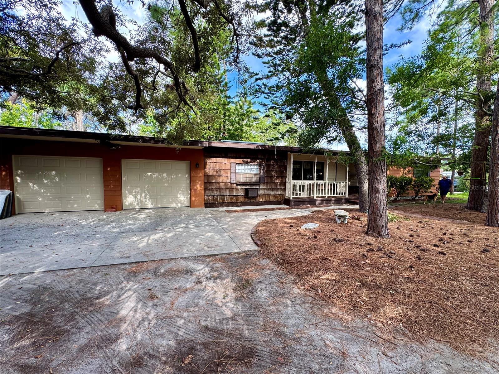 This cute 3 Bedroom 2 Bath home is nestled on a sylvan wooded lot, but is close to everything. Across the street from Mildred Helms Elementary School (featured in the movie “Dolphin Tale”), and ½ mile from Taylor Lake Park, as well as just a few easy miles to the beaches, this home is easy access to shopping, schools, and downtown Largo and Pinellas County. It also features original wood floors, a fenced backyard with a goldfish pond, grape vines, a two car garage and a handy carport and tool shed. It has a brand new hot water heater, 5 year old central air conditioning, an expanded driveway with plenty of parking, and a cozy front porch to sip ice tea on! In addition to the 3 nicely sized bedrooms, there is an interior bonus room which is approximately 15 x 15 making a great flex space! This house is very well located near parks, hospitals, and even the Largo Public Library! Let's make an appointment to see it today!