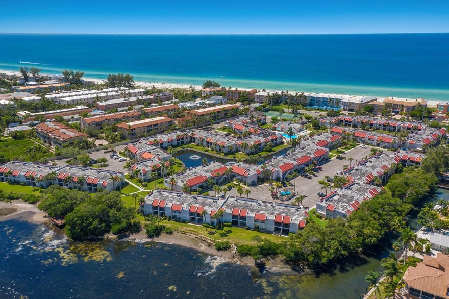 Step into coastal luxury living at its finest with this exquisite turnkey condo unit nestled between the serene waters of Palma Sola Bay and the majestic Gulf of Mexico on Anna Maria Island.

Indulge in the epitome of waterfront bliss as you revel in the leisurely sight of boats gracefully gliding by from the comfort of your own lanai porch. With two bedrooms, two bathrooms, and 1,080 square feet of meticulously designed space, this retreat promises the ultimate in convenience and relaxation.

Savor the culinary delights crafted in the fully equipped kitchen boasting ample cabinets and state-of-the-art appliances. Retreat to the primary bedroom oasis featuring an ensuite bathroom and a sprawling walk-in closet, offering a sanctuary of tranquility and luxury.

Elevating the experience further, this haven boasts numerous upgrades including a cutting-edge 3M water filtration system, recently replaced refrigerator and washer, as well as updated lighting fixtures throughout. Rest easy knowing that the HVAC system was replaced just two years ago, ensuring optimal comfort year-round.

Embrace the exclusive lifestyle with access to a plethora of community amenities including a Bocce ball court, fitness room, sauna, shuffleboard courts, and clubhouse. Unwind by the island's largest heated saltwater swimming pool or explore the pristine beaches via a signal crosswalk just moments away.

For those seeking investment opportunities, take advantage of the on-site rental manager providing comprehensive management services and support. Whether you're seeking a lucrative rental income or a personal sanctuary, this property offers the perfect blend of luxury and convenience.

Embark on endless adventures with convenient access to Gulf and Bay fishing spots, bike paths, and local shops, while the nearby Historic Bridge Street area beckons with its array of dining and entertainment options.

Seize the seaside dream and make this turnkey condo unit at Runaway Bay your coastal sanctuary today. Live the luxury lifestyle you deserve amidst the breathtaking beauty of Anna Maria Island.