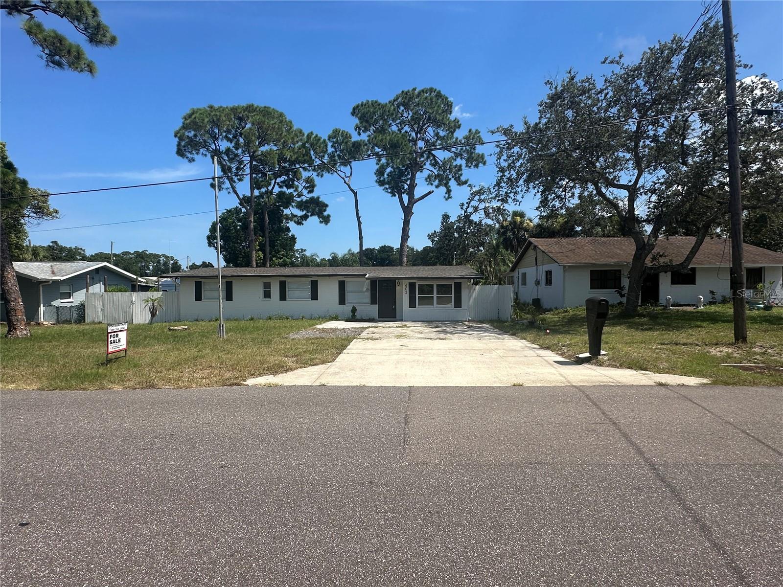 Welcome to your dream home in the heart of New Smyrna Beach, FL. This recently remodeled 3-bedroom, 2-bathroom gem boasts a host of modern amenities. The kitchen, equipped with new appliances and plenty of cabinet space, is a chef's delight. The home features beautiful wood floors throughout, ceiling fans for those warm Florida days, and all-new fixtures that add a touch of elegance. The large, fenced-in backyard is perfect for outdoor activities or simply enjoying the Florida sunshine. The home also includes washer/dryer hook-ups and an inside laundry room for your convenience. The master suite features a walk-in shower for a spa-like experience. Pet lovers will appreciate the pet-friendly policy (with restrictions). The home's location is unbeatable, being just a short drive to NSB and near Route 1. The beach is also within close proximity, perfect for those weekend getaways. The covered porch and large deck provide additional spaces for relaxation or entertaining. Experience the best of Florida living in this stunning New Smyrna Beach home. This property will be fully managed by the property owner during the lease term.