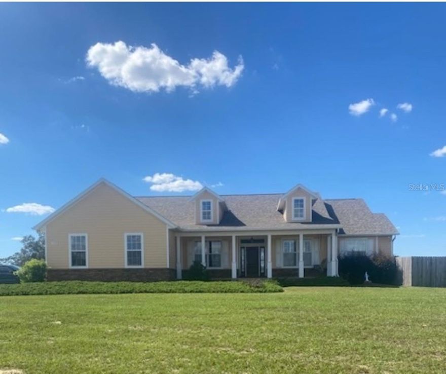 This 22+ acre property is ready to go. Property is fenced and cross-fenced and zoned A-1 for horses or cattle. • Currington-built custom Wellington V Country Elevation • 3 bedrooms, 2 ½ baths • New Roof (2025) • New ½ mile Limestone Driveway • Theatre room with professionally installed 101” screen, surround sound, and seating for 6 • Stem wall block construction • 10 – 14 ft ceilings, coffers, tray ceilings in master bedroom • Chair rail molding and wainscoting in dining and office • Crown molding • 8-foot doors • Custom Plantation shutters in Master bedroom, bathroom, and office • 2-inch wood blinds in 2 bedrooms • Oversized floor to ceiling windows and patio sliding doors that allow for plenty of natural light • Large Walk-in closet in Master bedroom • Master bath with footed bathtub, large walk-in shower, water closet, and 2 vanity areas with granite counters • Kitchen is open to the family room and eat-in dining area. • Granite countertops, real-wood cabinetry, and Walk-in pantry • Gas Fireplace in Family Room • Wall Mounted Flat Screen TVs in Family Room, Master Bedroom, and Office • Pelican Water Filtration System • 2 stage HVAC system, • 2 Rinnai tankless water heaters • Security system 
• Screened-in back patio and outdoor patio, 15 x 30 pool with paver decking • Saltwater pool chlorination system • Cabana metal roof covered patio for BBQ 
• Kubota 6.5KW Diesel generator pre-wired to provide 30amp service, a 250-gallon in-ground propane tank 
• 38 X 72 center row barn with 15’ aisle and 5 stalls features tongue and groove wood ceilings and partitions, a tack/feed room and ½ bath within the barn area; 12-foot overhang; 1 bedroom/ 1 bath apartment with a living room and kitchen, and 2 individual mini-split units. 
• A fully insulated and air-conditioned 36x21, steel-engineered building will be a favorite for your personal space or hobby. 12-foot overhang allows room for outdoor activities, including practicing in your personal outdoor range. 
• Open equipment shed with a metal roof 
 • Just 7 miles from the World Equestrian Center, centrally located in Ocala, and minutes from Gainesville or Orlando, where you will find several choices for restaurants, casual shopping, and entertainment. The Florida Greenways & Trails are also nearby, with miles of riding, biking, and hiking trails. This home has it all. Outdoor adventure, privacy, yet close to activities and your everyday needs.