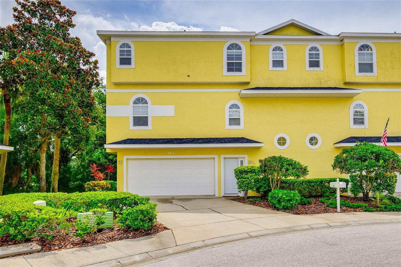 Welcome to 463 Bayou Village, a beautiful move-in ready three-story Townhome in the heart of Tarpon Springs! This property has been completely updated with three bedrooms, three full bathrooms and an oversized two car garage. The townhome does have a newly installed roof (2024) and a new A/C (2025) along with vinyl flooring in the living room and carpet throughout the rooms. The home comes with a personal elevator to bring you up to the 2nd floor so whether you choose elevator or the stairs you will make your way to the second story where you walk into a large open living/dining room right off the beautiful updated kitchen with granite countertops with all stainless steel appliances. Down the hall you will find your first bedroom with the bathroom across the way. This bedroom has a door that leads out to the wrap-around patio, which was just completely re-done (2024) which is perfect to enjoy the peaceful ambience of outside. Then taking the stairs to the 3rd floor where we find the 2nd bedroom and bathroom along with the master bedroom and bath! This townhome has large rooms and plenty of windows to let in all the natural sunlight. This townhome does have a washer& dryer as well in the laundry closet making it super convenient. This townhome is located in the heart of Tarpon Springs, just minutes if not seconds away from all the action. Whether you need to go to the grocery store, go to the gym or go out on a Friday night to attend Tarpon Spring’s First Friday event you could not ask for a better location. There are also so many amazing restaurants, breweries and boutique shops to choose from all located minutes away from you in the historic city of Tarpon Springs. Don't wait to schedule your showing today as this property may not be on the market for long.