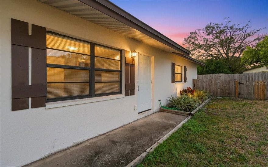 This well-maintained 2-bedroom, 1-bath duplex offers approximately 900 square feet of comfortable living space with thoughtful updates throughout. The kitchen features updated cabinetry, modern appliances, and clean, functional finishes that blend style with everyday usability. Both bedrooms are bright and inviting, offering ceiling fans, ample closet space, and soft carpeting. The bathroom has been tastefully updated with contemporary touches. Additional features include washer and dryer hookups and off-street parking. A standout feature of this home is the private, fully fenced backyard, providing a great space for relaxing, entertaining, or allowing pets room to play. Pet-friendly and conveniently located just minutes from Clearwater Beach, shopping, dining, parks, and major roadways, this property offers an excellent balance of comfort, privacy, and accessibility. One or more photos have been virtually staged.