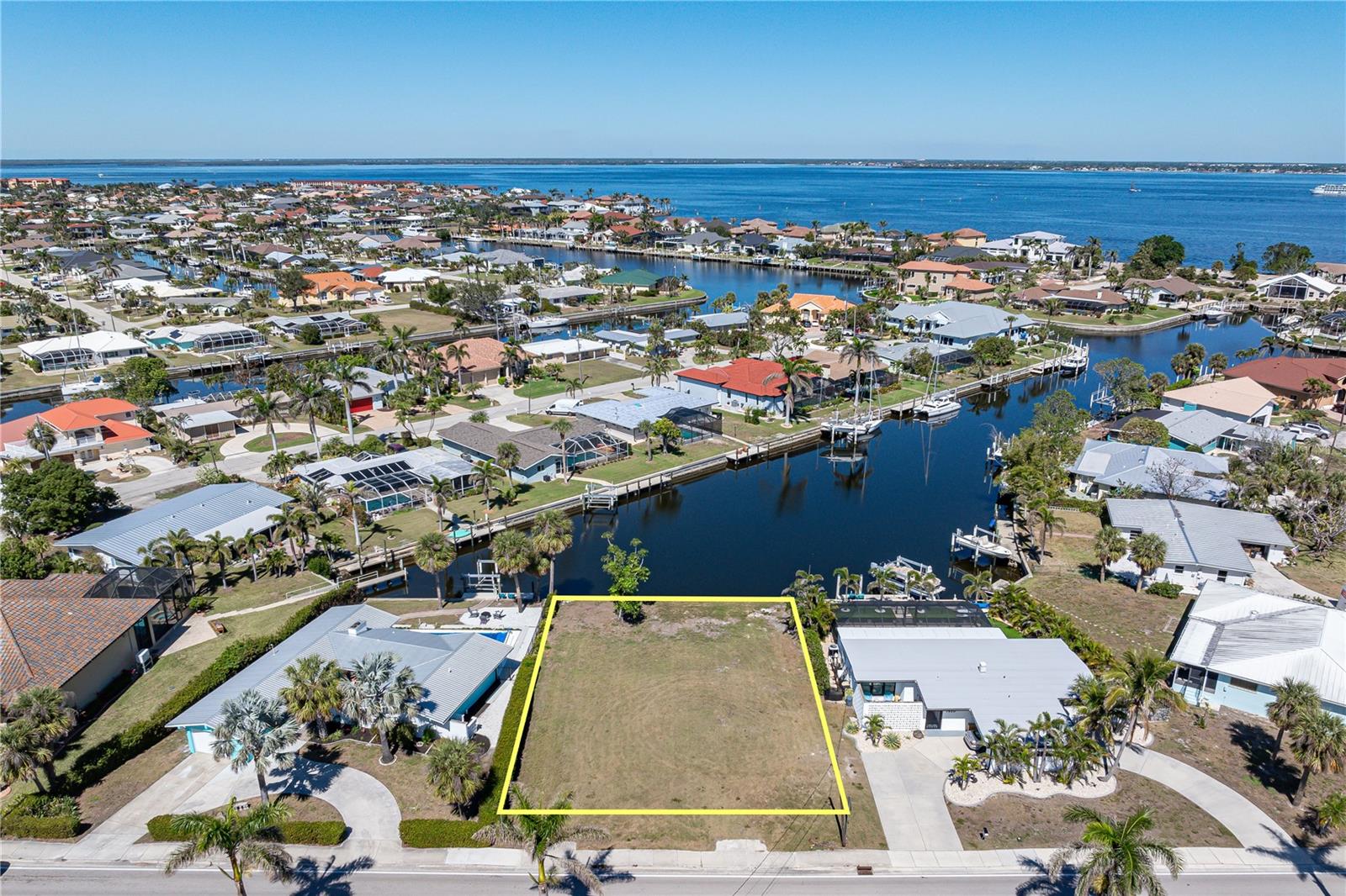 CALLING ALL BOATERS! - Now's your chance to build your dream home here...on this prime waterfront lot in Punta Gorda Isles w/FABULOUS LONG CANAL VIEW! Property features 80ft of seawall & very quick, deep water, sailboat access to Charlotte Harbor. Reach open water in mere minutes. Lot is located the original sailboat area of PGI & is surrounded by a mix of older & newer, custom-built homes. Property offers city water & sewer. Perfect spot for your custom home. Enjoy some of the best fishing & boating in SWFL from your backyard. Property was the location of a previous home which translates into possible reduction of thousands of dollars of IMPACT FEE SAVINGS. Claim your spot in paradise today! Close to everything - walking distance to Isles Yacht Club, Fishermen's Village & historic downtown. Rectangular shape is ideal for placing most local builder models right on lot.