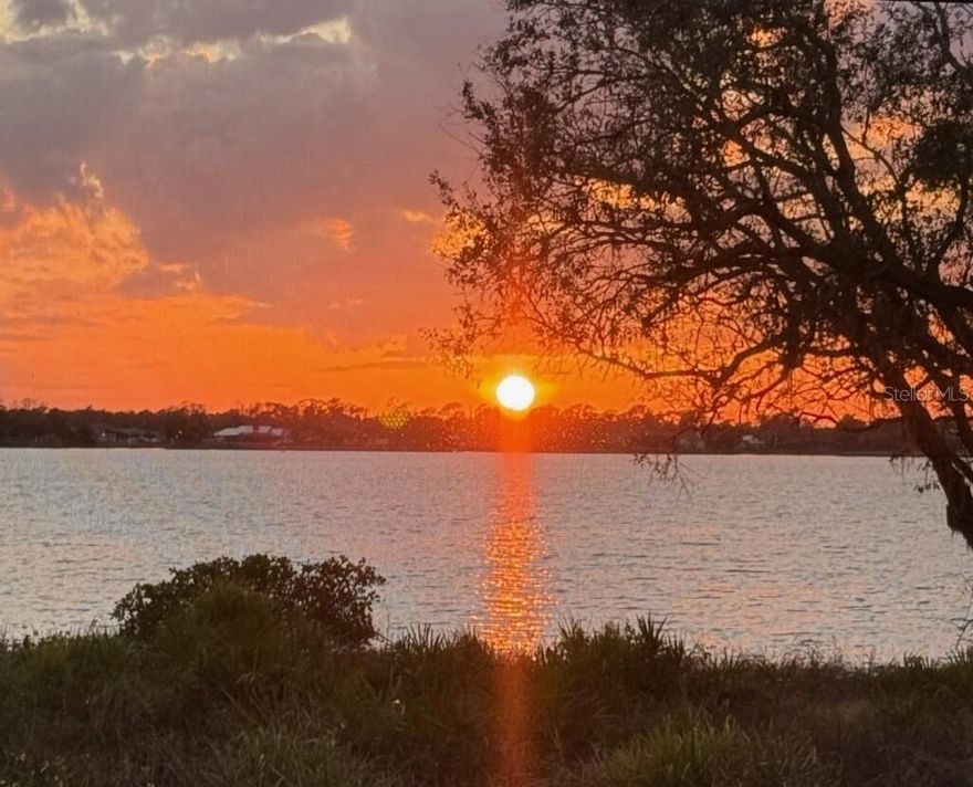 EXPERIENCE UNMATCHED RIVERFRONT LIVING in RIVERWOOD and ENDLESS BREATHTAKING SCENIC FLORIDA SUNSETS together with a TRANSFERABLE PRIVATE RIVERWOOD BEACH CLUB MEMBERSHIP on the GULF OF MEXICO.! Embrace a lifestyle of tranquility and sweeping natural beauty in this exquisite 3-Bedroom, plus Den, 3-Bath, 3-Car Garage customized Sussex model, perfectly positioned along the Myakka River in the highly regarded gated community of Riverwood. Tucked within the sought-after River Run neighborhood, this exceptional residence showcases rare, unobstructed panoramic river views and delivers the perfect blend of comfort, peacefulness and privacy. The moment you enter, an expansive, sunlit layout unfolds, featuring soaring 10-foot ceilings and diagonally laid tile flooring. The impressive Great Room takes center stage with its full wall of sliding glass doors, drawing your eyes directly to the breathtaking river backdrop. This inviting space flows effortlessly into the well-appointed kitchen, featuring solid wood cabinetry, stainless steel appliances, a breakfast bar, a large pantry, and a cozy dining nook bathed in natural light with tranquil water views. A formal dining room enhanced by a tray ceiling provides the ideal setting for memorable dinners and special occasions. Just beyond, the oversized lanai offers an exceptional outdoor living experience—perfect for gatherings or peaceful moments overlooking the river. The primary suite is a true sanctuary, complete with private lanai access, a tray ceiling, walk-in closet, and a luxurious en-suite bathroom offering dual vanities, a garden tub, and a spacious walk-in tiled shower. The second bedroom is positioned near a full pool bath, while bedrooms three and the Den share a convenient Jack-and-Jill bathroom. Step outside to discover your own serene riverside haven. The extended lanai features a screen pool cage, a costumed built sparkling pool and spa, and plenty of deck space to take in the captivating river views. Added Bonus NEW 2025 AIR CONDITONER and UPGRADED ROLL DOWN STORM SHUTTERS for a peace of mind. PLUS Turn Key Furniture Package Available. Ask Agent for Details. Riverwood is an Audubon-certified, master-planned community known for its lush natural surroundings and impressive resort-style amenities, including: Championship 18-hole golf course with top-tier practice facilities, Private Beach Club on Manasota Key, 18 Har-Tru tennis courts, 12 pickleball courts, Fitness and Activity Center, Bocce courts, championship croquet lawn, Clubhouse with restaurant and bar, Dog Park and miles of scenic walking and biking trails. Premier Location. Ideally located near the new Sunseeker Resort, Tampa Bay Rays and Atlanta Braves Spring Training facilities, and the stunning beaches of Boca Grande, Englewood, and Venice, this home provides effortless access to world-class boating, fishing, dining, and shopping. This is not just a home—it is an extraordinary lifestyle opportunity. Properties like this rarely become available. Arrange your private tour today and experience the magic of riverfront living in one of Southwest Florida’s most coveted communities.