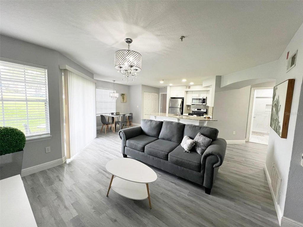 Photo of 7250 Westpointe Boulevard #1015, Orlando, FL 32835 (MLS # O6442078)