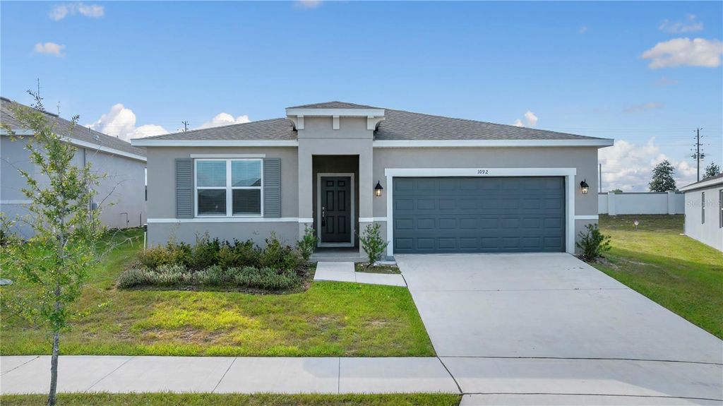 Photo of 1092 Patriot Loop, Haines City, FL 33844 (MLS # O6358597)