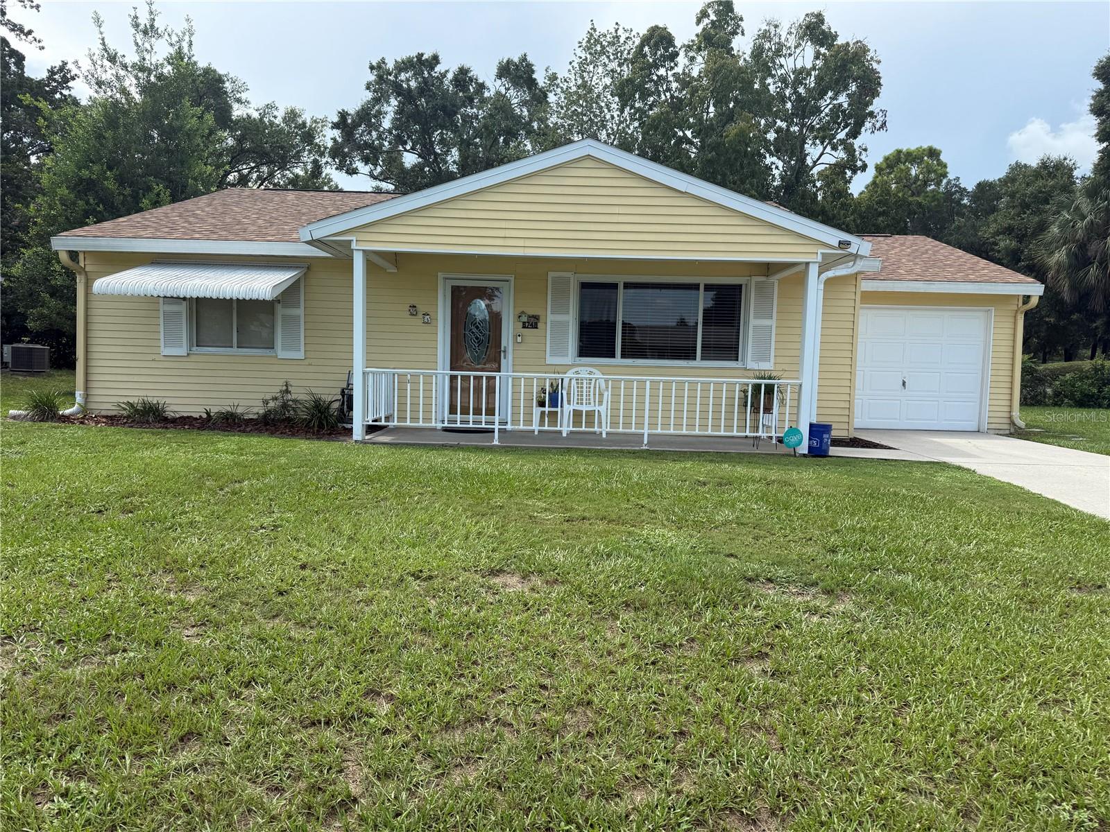 UPDATES, UPDATES, UPDATES, COVERED FRONT PORCH, ENCLOSED BACKYARD LANAI WITH OUTDOOR PATIO ,2021 ROOF.KITCHEN COUNTERTOPS AND CABINETS REPLACED.BATHROOMS HAVE REPLACED COUNTERTOPS, TILE, VANITIES .ALL DUCT WORK REPLACED AS WELL ALL APPLIANCES INCLUDED. NO POPCORN CEILLINGS