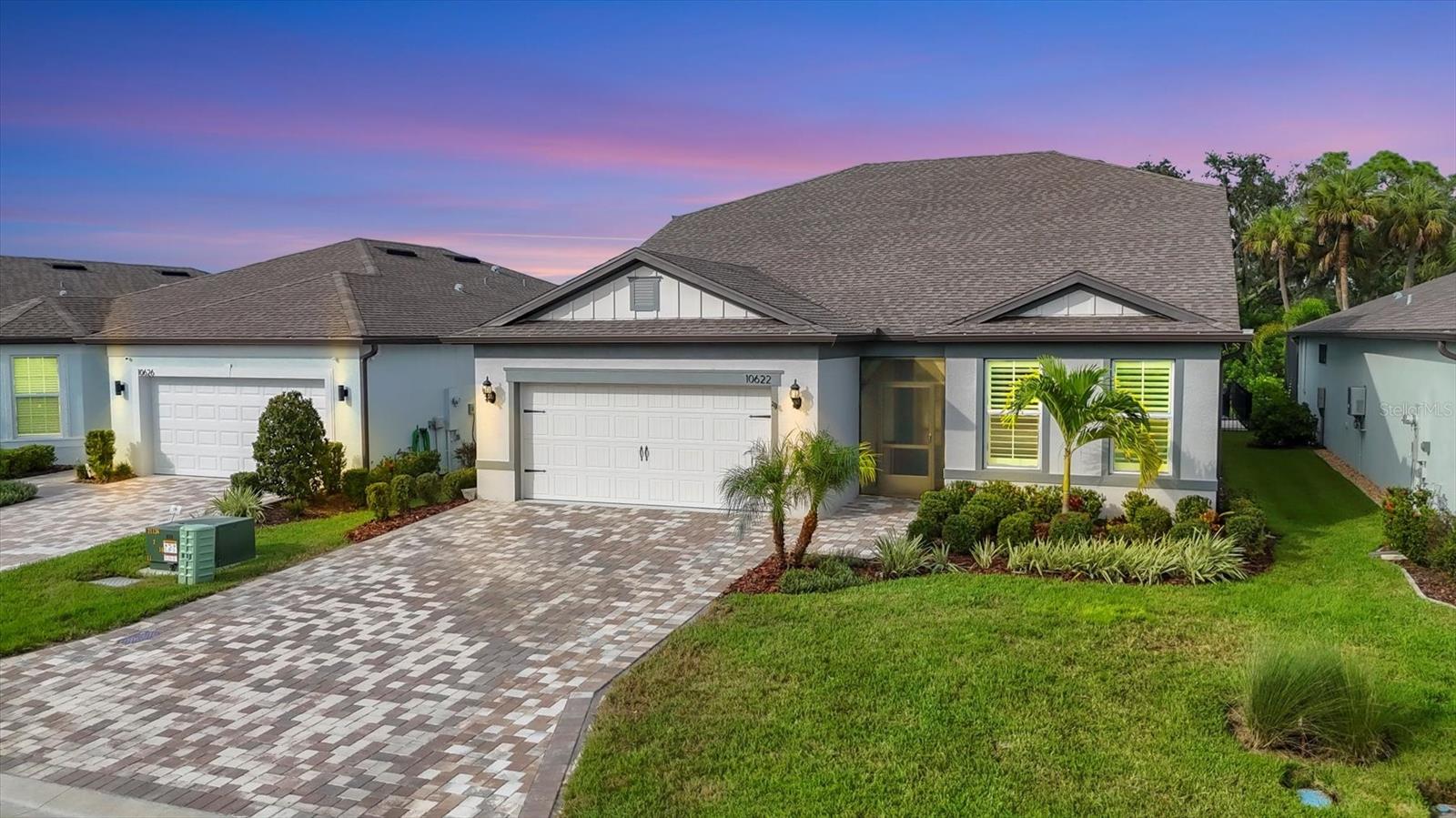 Welcome to your dream home in Del Webb, Parrish’s premier 55+ community! This stunning Mystique Grand model offers 3 bedrooms, 3 bathrooms, and 2,867 sq. ft. of beautifully designed living space. Lightly lived in and meticulously maintained, this home feels like new and is loaded with thoughtful upgrades. Step inside to find luxury vinyl plank flooring throughout the first floor, custom plantation shutters, and upgraded fans and lighting in every room. The open-concept layout flows seamlessly into the chef-ready gourmet kitchen and spacious living areas, perfect for both entertaining and everyday comfort. Enjoy the privacy of being the only fenced home in Del Webb, backing to a quiet, unbuildable preserve for serene views and no rear neighbors. Outdoor living is made easy with a concrete lanai pad and widened driveway, plus the home is pre-wired for a generator, outdoor kitchen, and pool — giving you endless options to customize your oasis. Home was built with an oversized 3-car tandem garage. Additional features include a whole-home water softener and overhead garage storage, maximizing convenience and comfort. Del Webb Parrish offers world-class amenities, including multiple resort-style pools, included a shaded pool, jacuzzi, fitness center, clubhouse, pickleball/bocce/ & tennis courts. The community's lively calendar of activities appeals to every interest.