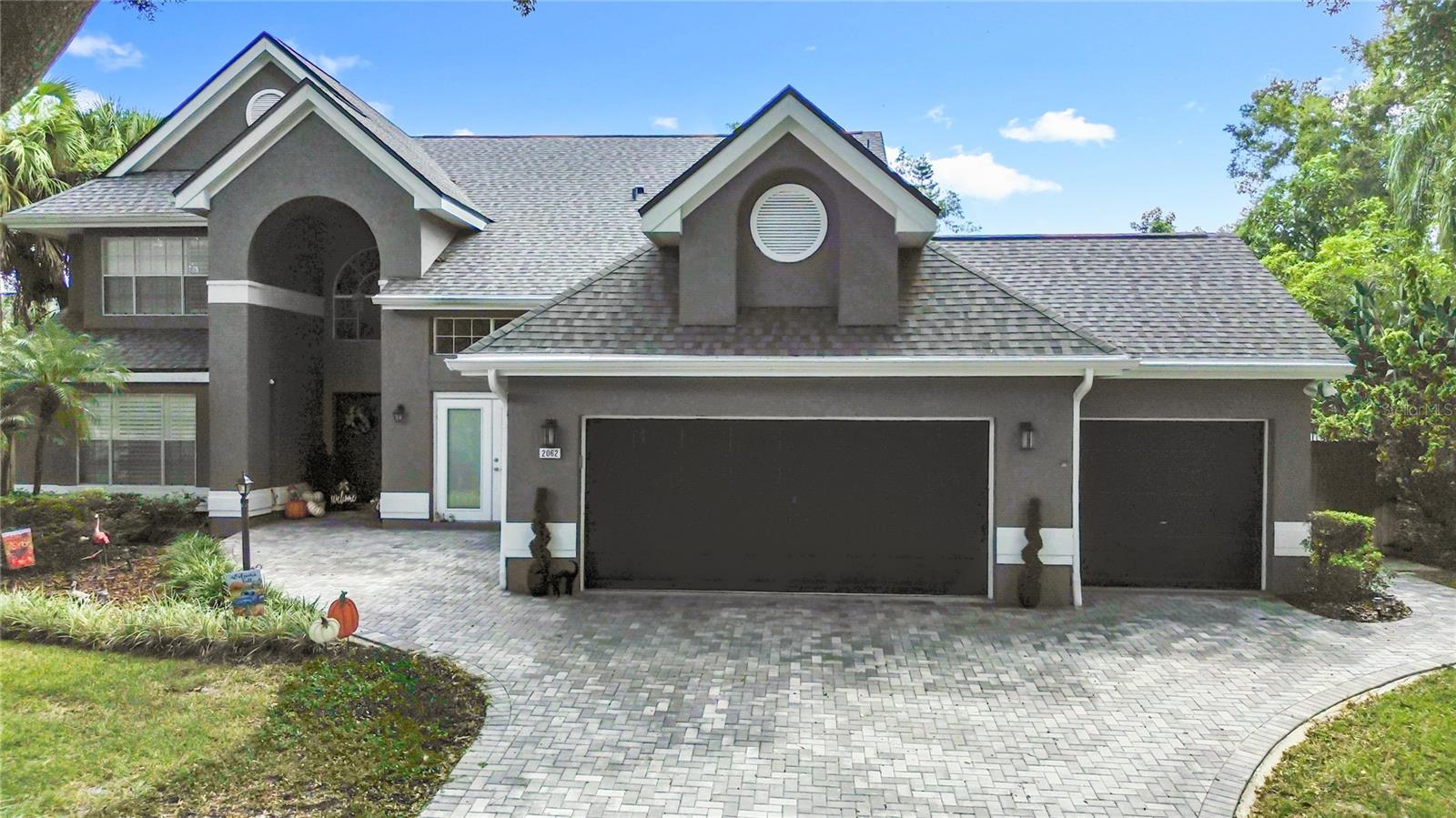 Welcome to your private retreat in Lexington Club! Tucked away in one of Apopka’s most desirable communities, this beautifully maintained solar-powered pool home offers nearly 3,000 square feet of living space designed for comfort, style, and everyday connection. Step inside to a light-filled layout featuring multiple living and dining areas, perfect for entertaining or relaxing with family. The updated kitchen shines with granite countertops, stainless steel appliances, and abundant cabinet storage, flowing seamlessly into the main living area for effortless hosting. Upstairs, the spacious primary suite is a true retreat, complete with soaring ceilings, a cozy sitting area, and a luxurious en suite bath with dual granite vanities, soaking tub, and walk-in shower. Three traditional bedrooms are located upstairs, plus a room off of the master and office on the first floor. Step outside to your own backyard oasis—an expansive screened-in pool recently resurfaced and enhanced with new travertine tile and a French drain, creating a stunning, low-maintenance outdoor space perfect for year-round enjoyment. The covered patio and fully fenced backyard offer privacy and relaxation amid lush landscaping. Major updates bring peace of mind, including a new roof (2023), A/C (2024), water heater (2019), and solar panels for added energy efficiency and long-term savings. Seller is willing to pay off solar panels with an acceptable offer or willing to accept a lower offer if the buyer is able to assume the payment of $195 a month through sun run. A transferable termite bond provides an extra layer of protection for future owners. Located in Lexington Club, a quiet, established community with tree-lined streets and low annual HOA fees, you’ll enjoy easy access to shopping, dining, and major roadways. Experience the perfect balance of space, sustainability, and style—schedule your private showing of today!