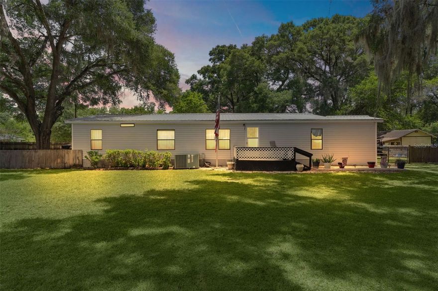 COUNTRY CHARM WITH INCREDIBLE OUTDOOR FUNCTIONALITY! Situated on a spacious corner lot of nearly half an acre in Summerfield, this 3-bedroom, 2-bath manufactured home offers comfortable living both inside and out.
The home features a large primary suite with a walk-in closet and a unique safe room/storm shelter conveniently located off the primary bedroom, providing added peace of mind. An electric fireplace with remote control adds warmth and ambiance while offering supplemental heat during cooler months.
Step outside and discover what makes this property truly special. The expansive lot offers an impressive collection of outdoor amenities, including a carport, multiple storage sheds, a storage container, and a chicken coop. Whether you're looking for space for hobbies, gardening, animals, equipment, or extra storage, you'll appreciate the versatility this property provides. The fenced side and rear yard areas offer additional functionality for pets, recreation, or outdoor enjoyment.
With nearly half an acre, abundant storage, a desirable corner-lot location, and unique features rarely found together, this property presents an excellent opportunity to enjoy country-style living with plenty of room to work, play, and grow.