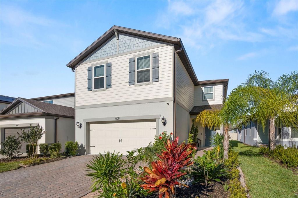 Photo of 21051 Monza Loop, Land O Lakes, FL 34638 (MLS # TB8473987)