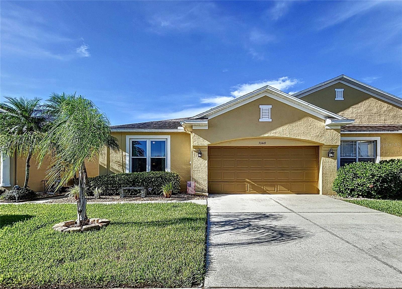 Looking to relish the lavish views of whispering palms from your brick paver patio with built-in fire pit and your favorite beverage after a stressful day at work? You’ve found it! Oversized one story villa featuring 3 bedrooms, 2.5 baths, office or extra room and 2,033 living sq ft with fully fenced back yard is ready for new owners. Luxury vinyl plank flooring predominates throughout all the main living areas. A brand-new double entry door with beveled leaded glass greets you as you enter the home. The state-of-the-art kitchen features quartzite countertops, oversized island, 5 burner gas range, stainless steel appliances, subway tile backsplash, 10 in. deep undermount stainless steel sink, walk-in pantry and modern style LED fan. Other fine attributes include a water softener, tankless gas fired water heater, motion detection security lights, security system, ring doorbell, new energy efficient dual pane windows throughout, extra blown in insulation in attic, gutters and downspouts, heavy duty locking slider, surround sound speakers in great room, irrigation system with reclaimed water and all appliances included. Lettingwell & Meadow Pointe II have fabulous community amenities including highly rated schools, ‘A’ rated Dr John Long Middle & Wiregrass Ranch High within 1 mile, lagoon style pool, splash zone, cabanas, clubhouse, fitness room, meeting rooms, covered playground, lighted tennis, pickleball & basketball courts and a new heated lap pool coming in 2026. Strategically located in the heart of Wesley Chapel close to 2 interstates, Lettingwell is within minutes of 3 hospitals, brand new library, a new YMCA coming in 2026, Tampa Premium Outlets Mall, the Shops at Wiregrass, the Grove & Krate entertainment areas, PopStroke Golf, Main Event gaming facility, Advent Health Center Ice – the largest ice-skating facility in the Southeast, and numerous top of the line restaurants. Make your appointment today! Listing agent is owner.