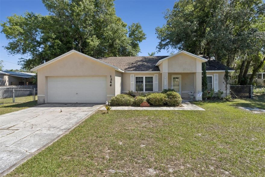 Canal-front 3 bed / 2 bath block & stucco home on 113 ft of canal in the peaceful Shady Cove area of Haines City — no HOA, no restrictions, direct water access to Lake Marion. Built in 2005 and sitting on a 0.39-acre lot with 113 feet of canal frontage, this 1,672 sq ft single-story home offers the rare combination of newer construction, solid block construction, and true waterfront living at an approachable price point. The open layout features a master suite with walk-in closet, central kitchen with dishwasher, range, range hood, and refrigerator, and a cozy wood-burning fireplace in the living area. Carpet and laminate flooring throughout, ceiling fans, central A/C and central heat, and a 2-car attached garage on a slab foundation with shingle roof.nStep outside to your private backyard and 113 feet of canal frontage — cast a line right from your own shoreline or launch the boat from the nearby public ramp for quick access to Lake Marion, a 3,021-acre lake renowned throughout Central Florida for bass and crappie fishing. Zoned RC with no HOA, no lease restrictions, and Flood Zone X (no flood insurance required by most lenders) — bring the boats, trailers, and RVs. Located minutes from US-27, Posner Park, Legoland, and a straight shot to both Orlando and Tampa corridors. A large new shopping plaza, Crossroads Village Center, is coming soon to Haines City. Whether you're looking for a full-time residence, a weekend retreat, or a short-term/vacation rental investment, this canal-front home delivers lifestyle and upside. Public water, septic sewer, homestead exempt. Schedule your showing today — waterfront with these specs doesn't last.