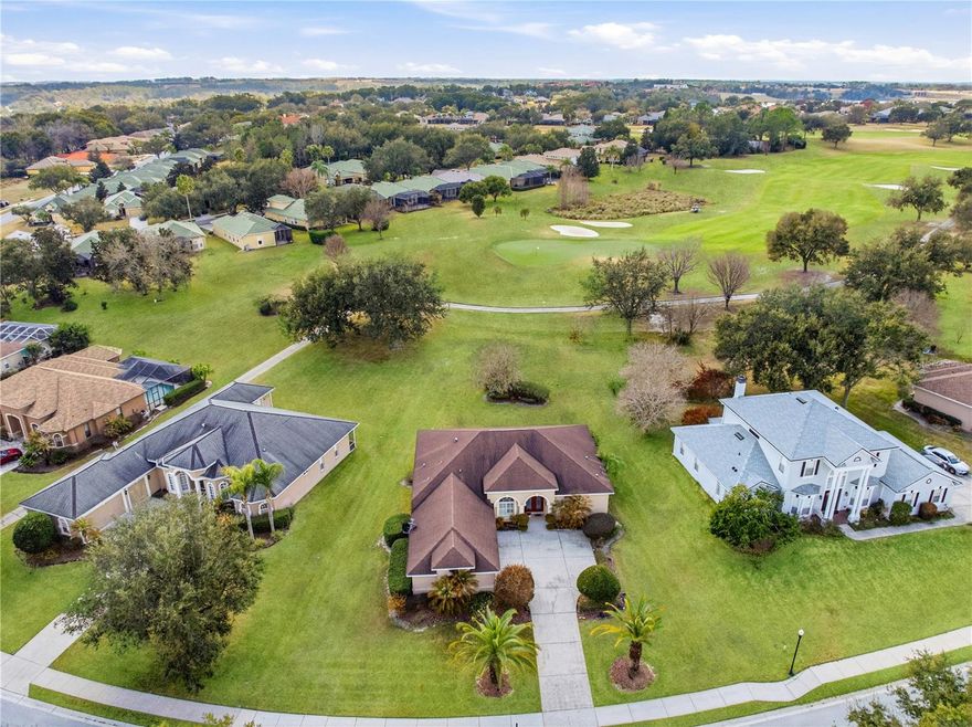 This beautiful 3 bedroom, 3 bath room, 3-car garage home in gated Lake Jovita Golf and Country Club, features ample arches, columns, niches, moldings, and tray ceilings throughout its 2,153 sf of living area. The open floor plan is perfect for entertaining and its numerous windows allow for an abundance of natural light. Sitting on a 1/2 acre lot with scenic views towards the front and the backyard facing the golf course, Lake Jovita is conveniently located 20 minutes from the shopping, dining, and entertainment scene of Wesley Chapel and nearby the small historic feel of downtown Dade City. It offers low quarterly HOA fees covering common areas and a community park. A clubhouse, two championship golf courses, gym, tennis courts, pool, and dining. Ready to enjoy this stunning property? Make it yours! *Membership to the clubhouse is optional. *Grass color in 1 aerial photo has been 'virtually improved'; no other changes.