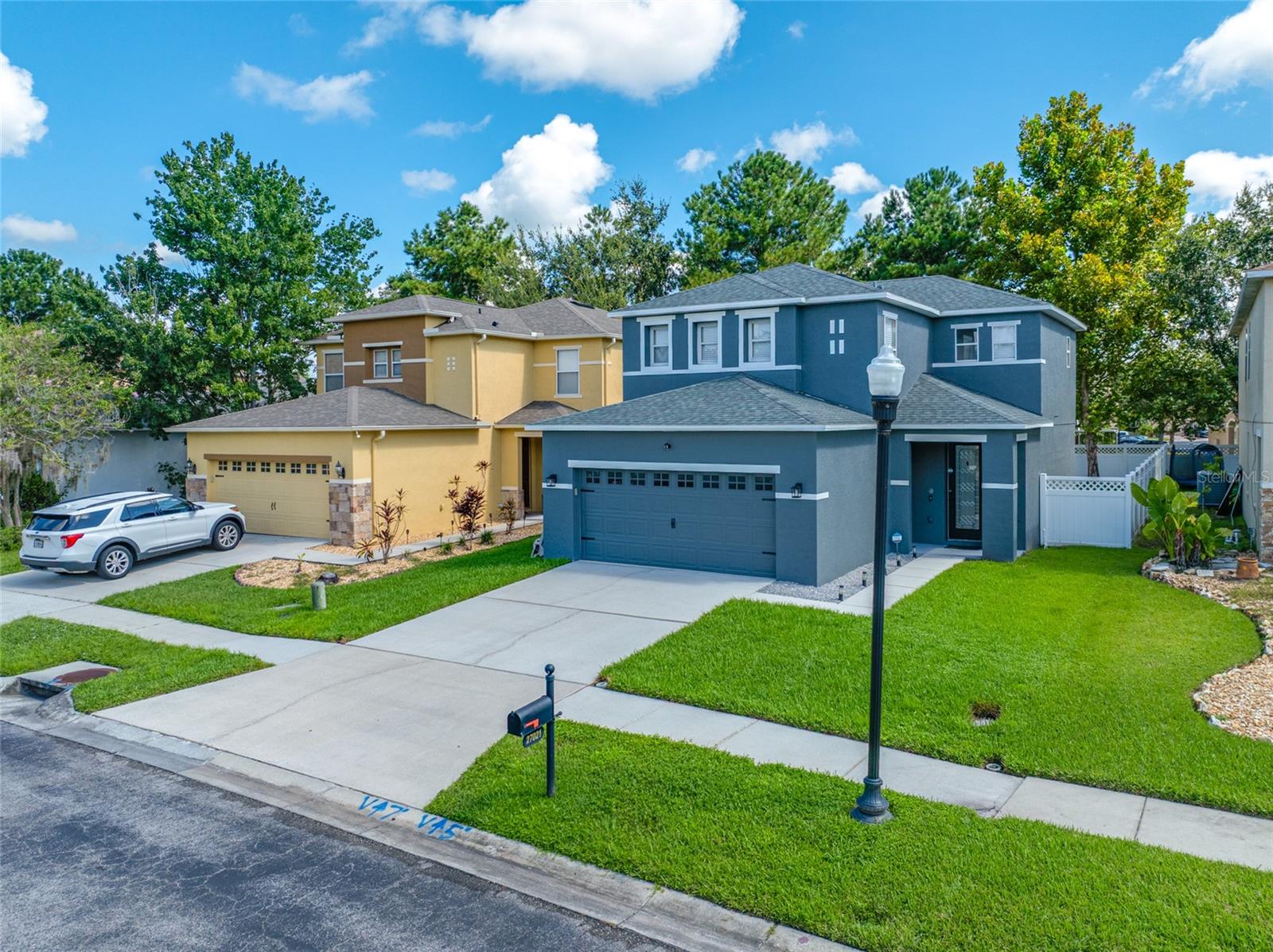 Lovely and completely remodeled 3/2.5/2 in the established community of Seven Oaks! This sought after subdivision is located in the heart of Wesley Chapel and close to everything. Open floor plan with living/dining room combo. Both the kitchen AND bathrooms have recently been updated. NEW countertops in kitchen, wood cabinets with gold fixtures/faucet, stainless steel appliances and NEW backsplash, laminate flooring throughout. Backyard is completely fenced in with plenty of room for pets or play. Recessed lights, and plenty of windows to let in the natural light. Primary bedroom with en suite showcasing a garden tub to relax and stand alone shower. Walk in closet offers plenty of closet space with a California closet system for added storage and to stay organized! Additional bedrooms are a generous size and updated second bath! FRESH EXTERIOR PAINT, NEW WATER HEATER, ROOF IS 2023, AC 2020, Home is WIFI equipped with Alexa switches, outdoor/indoor security camera and alarm will stay. Seven Oaks is the ultimate in residential living with multiple playgrounds, RESORT STYLE pools with splash pad, tennis and basketball courts and community clubhouse. This jewel does not need a thing and MOVE IN READY!