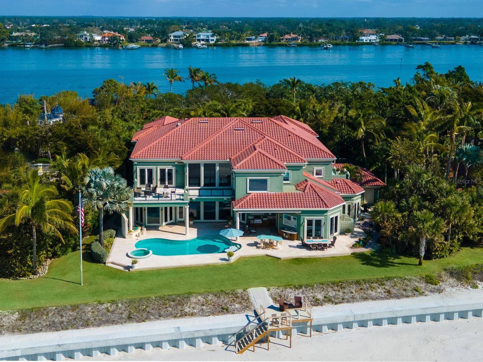 Auction Property. AUCTION PROPERTY: BID AUGUST 17-23. Previously listed for $18M. No Reserve. Showings every day through Tuesday August 22 from 1-4pm, Wednesday August 23 from 11-2pm & by appointment. Gulf-front paradise has never been sweeter than from exclusive Casey Key. A truly perfect location on 149±feet of pristine sandy walking beach meets its match with the six-bedroom estate of 2305 Casey Key Road. Inspire awe from the first look at the soaring architecture of the entry, where floor-to-ceiling, 12-inch windows and ornate double staircases frame dazzling views of the Gulf of Mexico. Both comfort and luxury are paramount here, with a careful balance between formal and casual entertaining spaces that welcome gatherings from intimate to grand. Gather for family brunch in the deluxe kitchen against a backdrop of Gulf views, or host a gourmet meal in the sumptuous octagonal formal dining room. Outdoors, treasures like the beachfront heated saltwater pool with heated spa and expansive sunset terrace promise a seamless experience no matter the venue. A deeded bayfront dock with 24,000-lb. lift ensures this estate’s splendor stretches beyond the private beach to the Gulf itself.