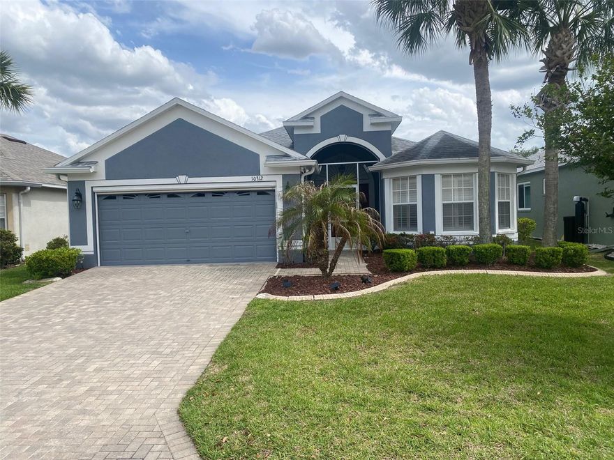 If you're seeking a gorgeous, 1,682 square foot move-in ready home in the amazing Tampa Bay Golf & Country Club community, this is it! This home has amazing curb appeal featuring pristine landscaping, with lava rock, new exterior paint, paver driveway and so much more. All three bedrooms, and the Primary bathroom have beautiful plantation shutters, spectacular hardwood floors, and more. The garage has a utility sink, a ton of storage, and owned water softener, as well as a portable Generac generator. Solid white solid wood cabinetry, tasteful backsplash, granite and new stainless steel appliances. The lanai is amazing! 17.5'X12' with real sliding windows with screens and ceramic tile floor. TBG&CC has two incredible golf courses, the 18-hole Championship course and a 9-hole executive course. The golf courses here are impeccable and very well-maintained. Tampa Bay Golf & Country Club is Tampa Bay's premier active 55+ community featuring two swimming pools (the large resort-style pool has fountains and is heated to a balmy 80 degrees). Pickleball, tennis, cards, bocce, shuffleboard, cornhole, and more activities than anyone could possibly do! Our new activities center has a HUGE fitness center with state-of-the-art fitness equipment, a beautiful billiards room, and an amazing card room. TBG&CC has no CDD and very affordable HOA charges, which include Cable/Internet/DVR and Mini Box. The Tampa Bay Golf & Country Club is Tampa Bay's most desirable 55+ Active community. All room sizes are approximate and should be confirmed by buyer(s). There is a ONE-TIME Social Membership Fee of $3,500.00 due at closing.